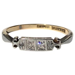 Art Deco Diamond, Platinum and 18 Carat Gold Four Stone Panel Ring