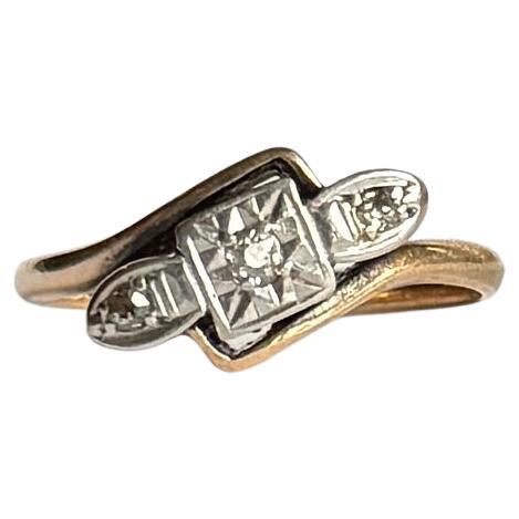 Art Deco Diamond Platinum and 9 Carat Gold Twist Three Stone Ring
