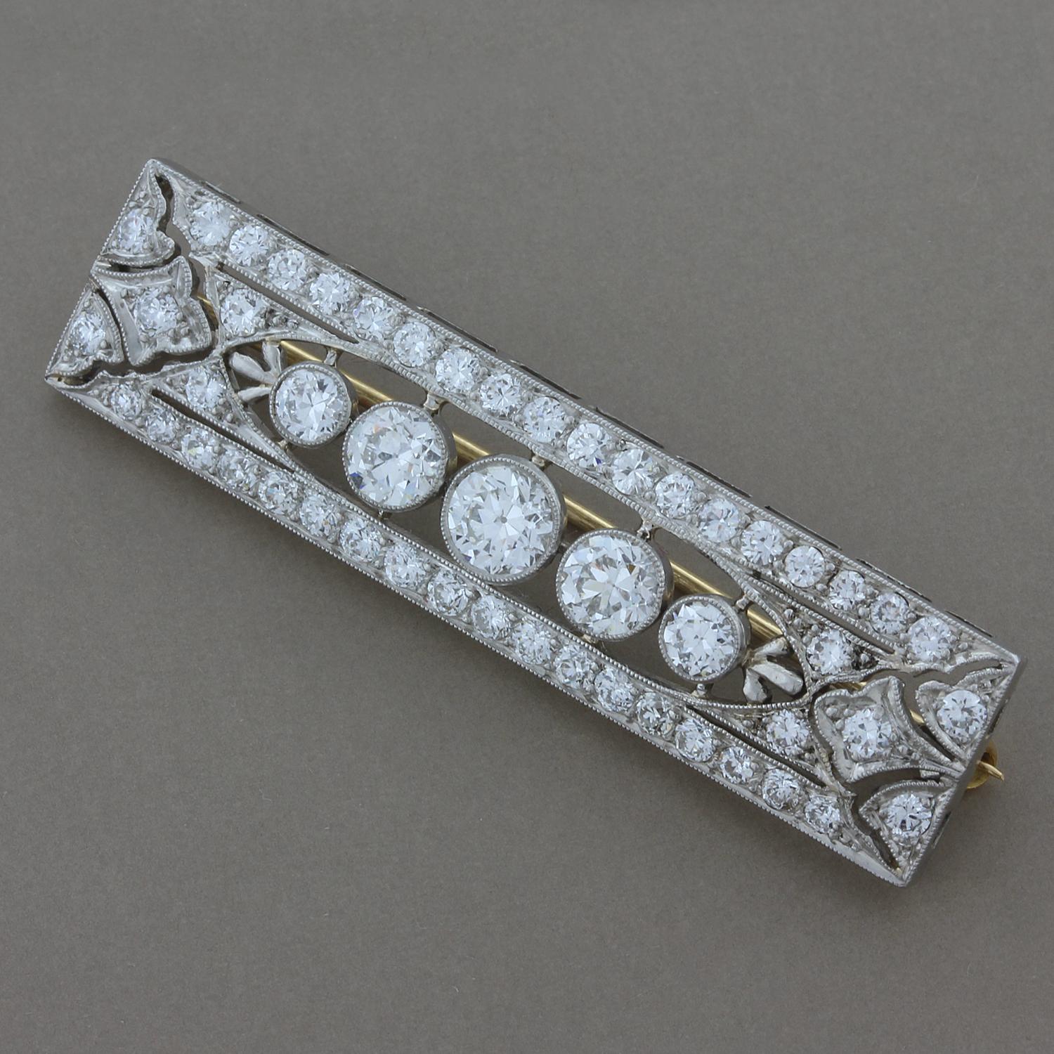 A classic Art Deco/Edwardian style piece, this bar pin brooch features 3 carats of European cut diamonds set in platinum. Finished with fine miligrain on the edges of the platinum and a 14K gold pin. A piece transitioning from the Edwardian filigree