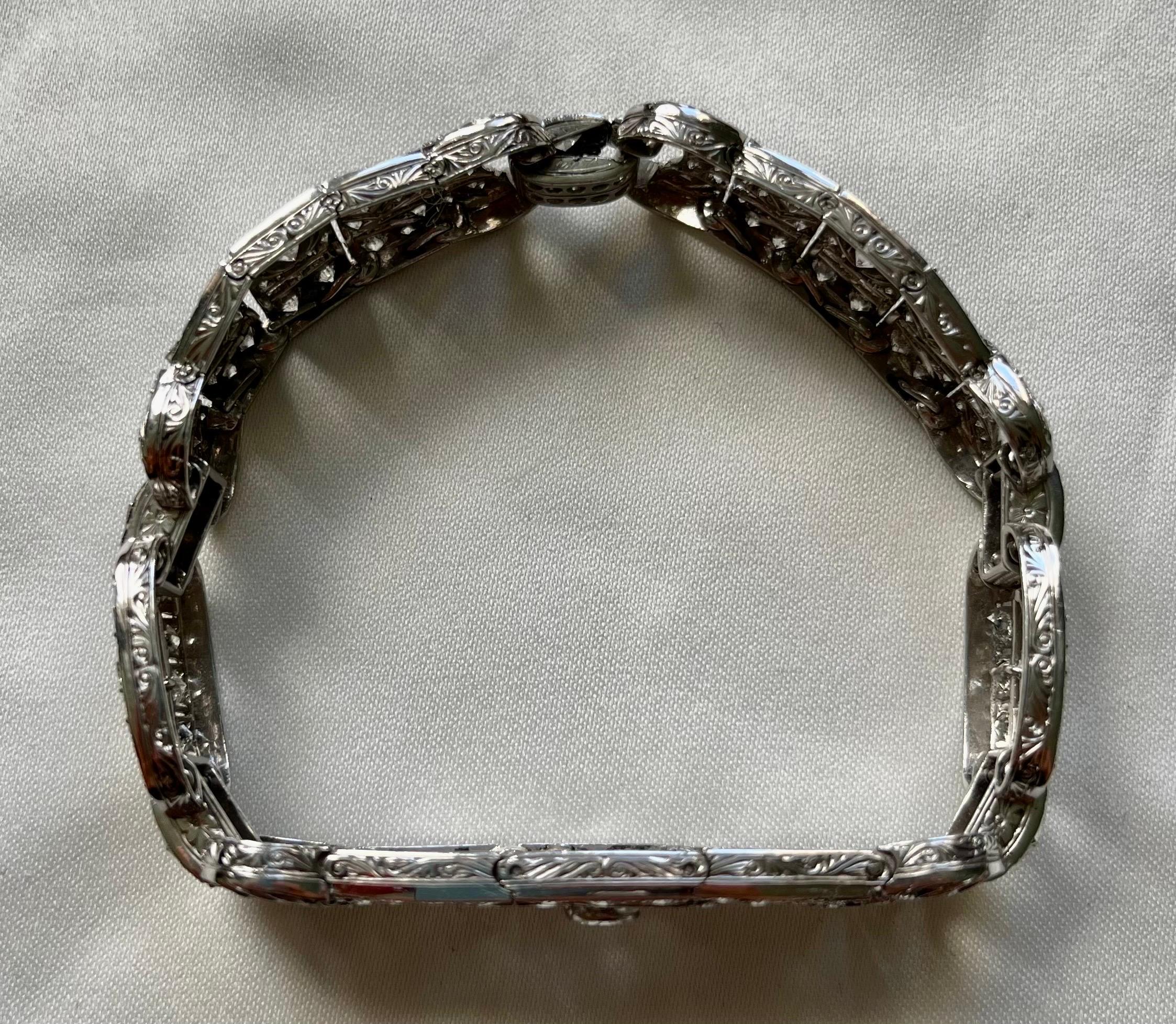 1930's original Art Deco antique diamond bracelet. 

Formed as a series of openwork panels set throughout with single, old brilliant, and step-cut diamonds, mounted in platinum, diamonds approx 5.40cts total, length 17.8cm.

This exquisite art deco