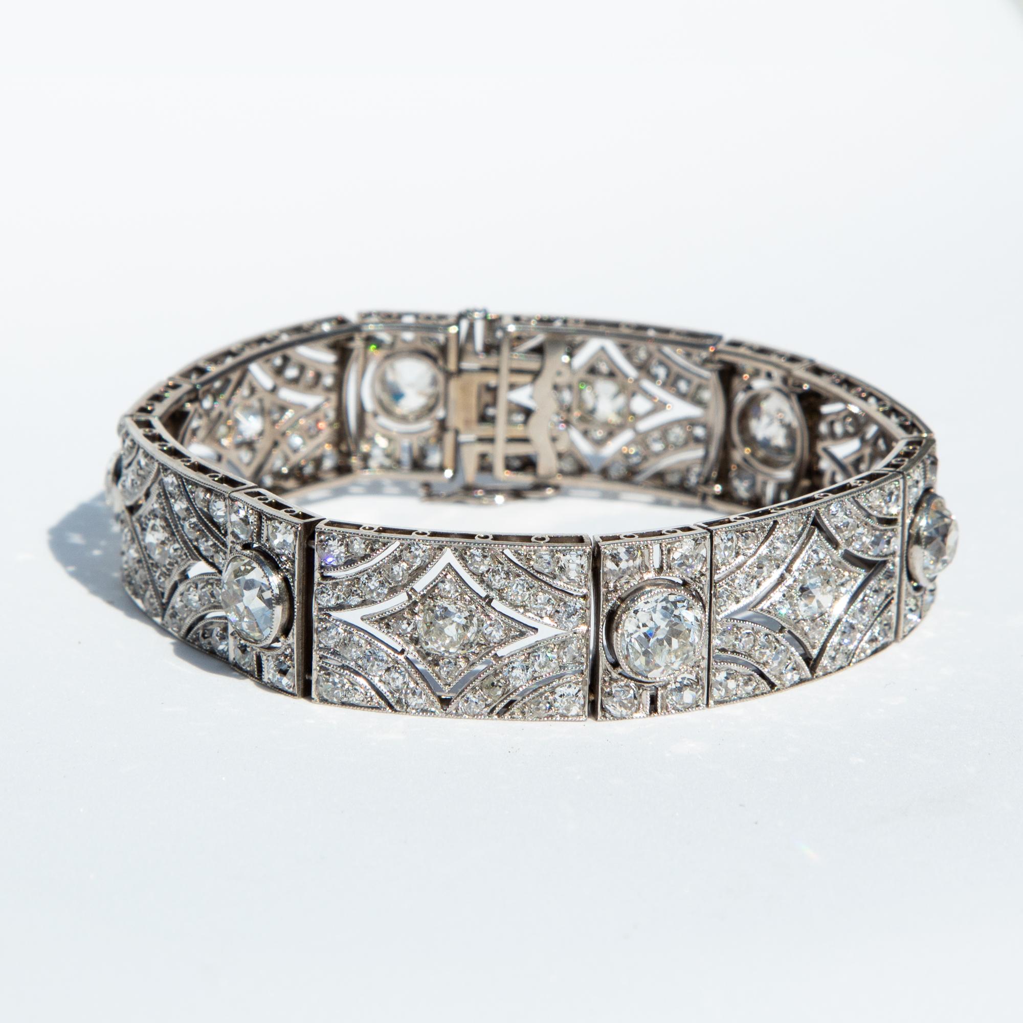 A beautifully intricate Art Deco diamond bracelet set in platinum. The six old European cut diamonds measure over 1 carat each with one further diamond of approximately 70 points. Total diamond weight certified 12.84 carats, G/H/K/L colour and