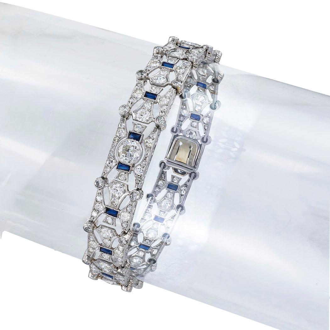 Art Deco diamond and blue stone platinum articulated bracelet circa 1925. 

SPECIFICATIONS:

DIAMONDS:  one hundred ninety-four old round cut diamonds totaling approximately 7.00 carats, approximately H-L color, VS-SI clarity.

GEMSTONES: 