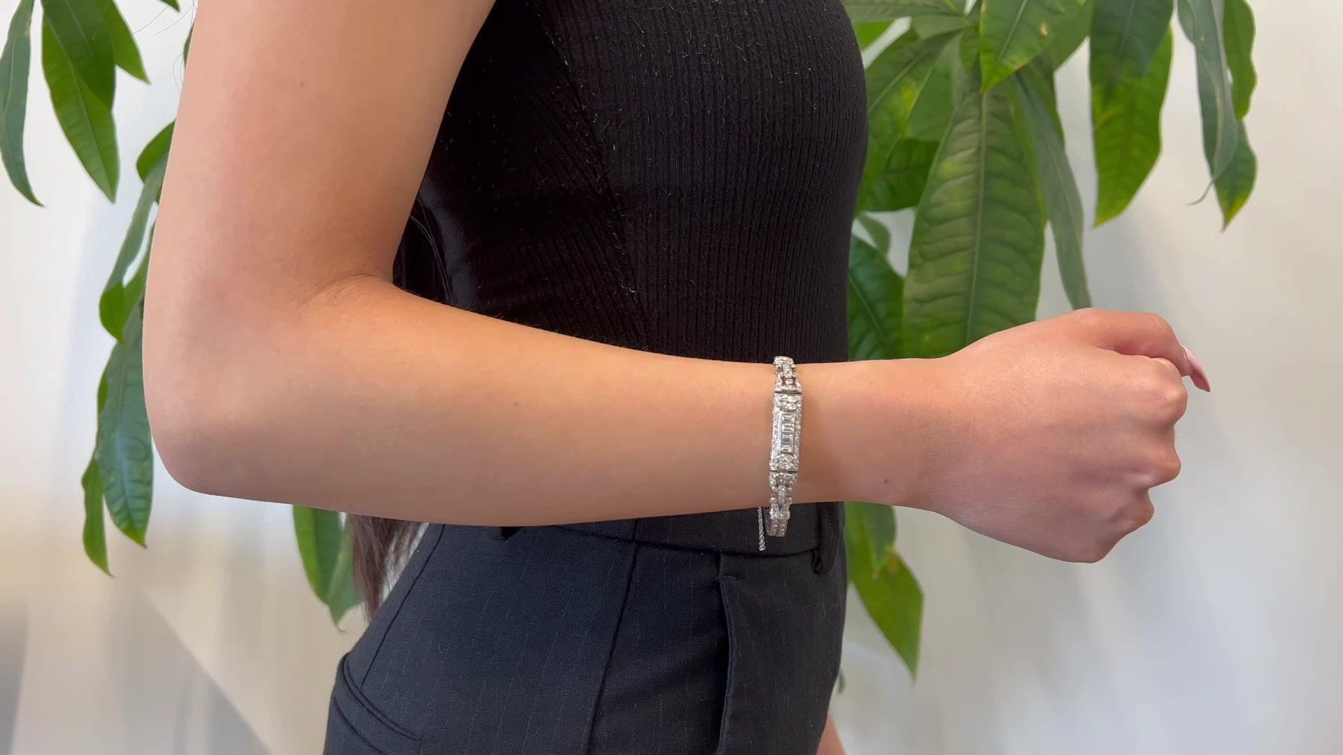 One Art Deco Diamond Platinum Bracelet. Featuring six marquise cut and four emerald cut diamonds with a total weight of approximately 1.00 carat, graded near-colorless, VS-SI clarity. Accented by 126 single cut diamonds with a total weight of