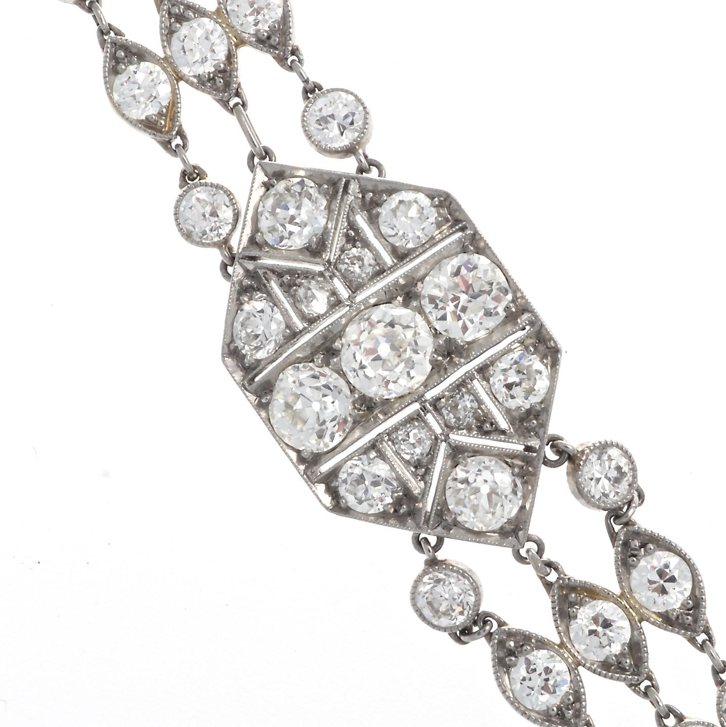 Get your wrist stacked with diamonds. Art Deco diamond platinum bracelet, featuring 77 old European cut diamonds that weigh approximately 9 carats, and graded G-H color, mostly VS clarity, with some SI clarity stones. Circa 1910. 6-3/4 inches long x