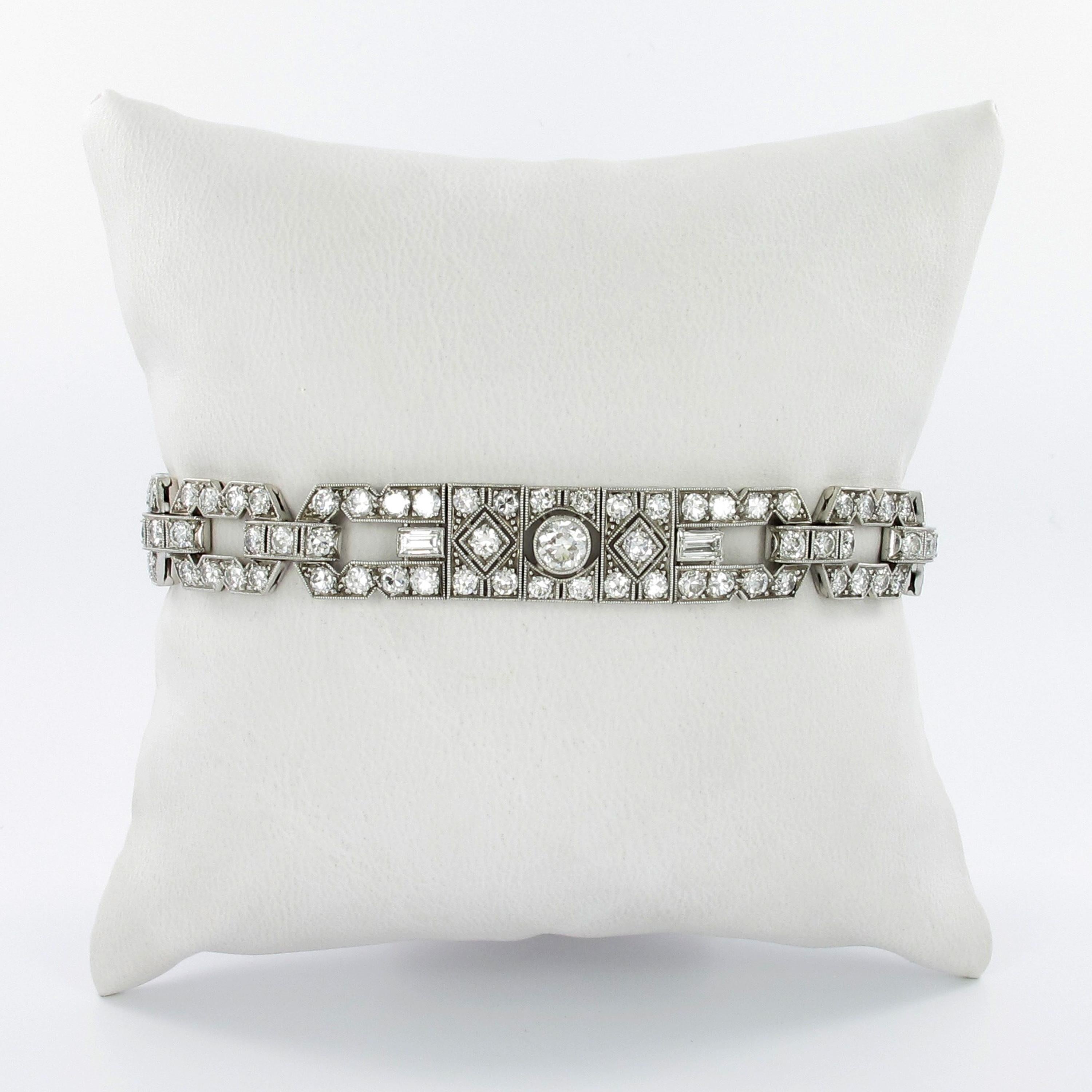 This timeless and charming Art Deco bracelet in platinum 950 is set with 3 Old European cut diamonds of G/H color and vs clarity, total weight approximately 0.87 carats. Accented by 6 baguette cut diamonds of G/H color and vs clarity, total weight