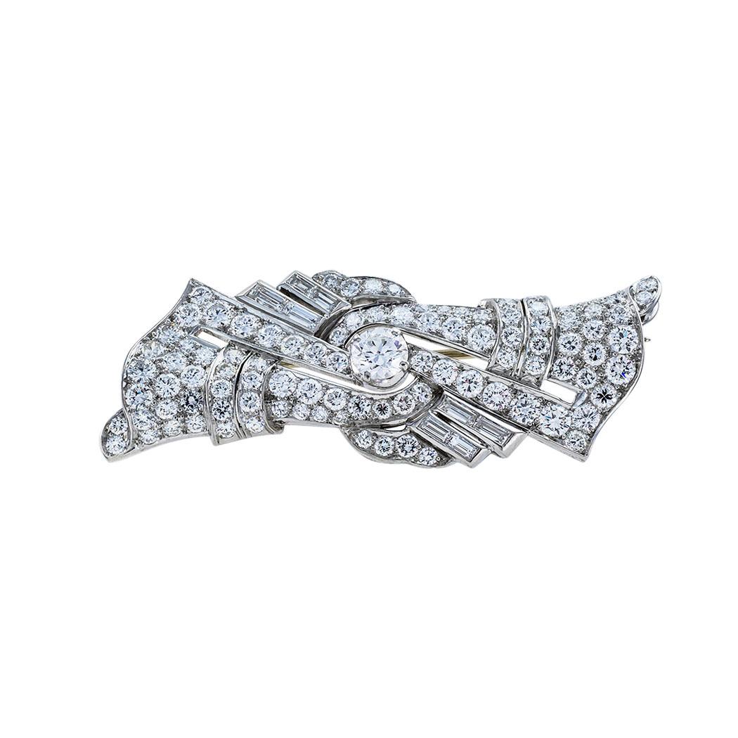Art Deco diamond and platinum brooch circa 1930.  

Contact us right away if you have additional questions.  We are here to connect you with beautiful and affordable antique and estate jewelry.

SPECIFICATIONS:

DIAMONDS:  one hundred seven baguette