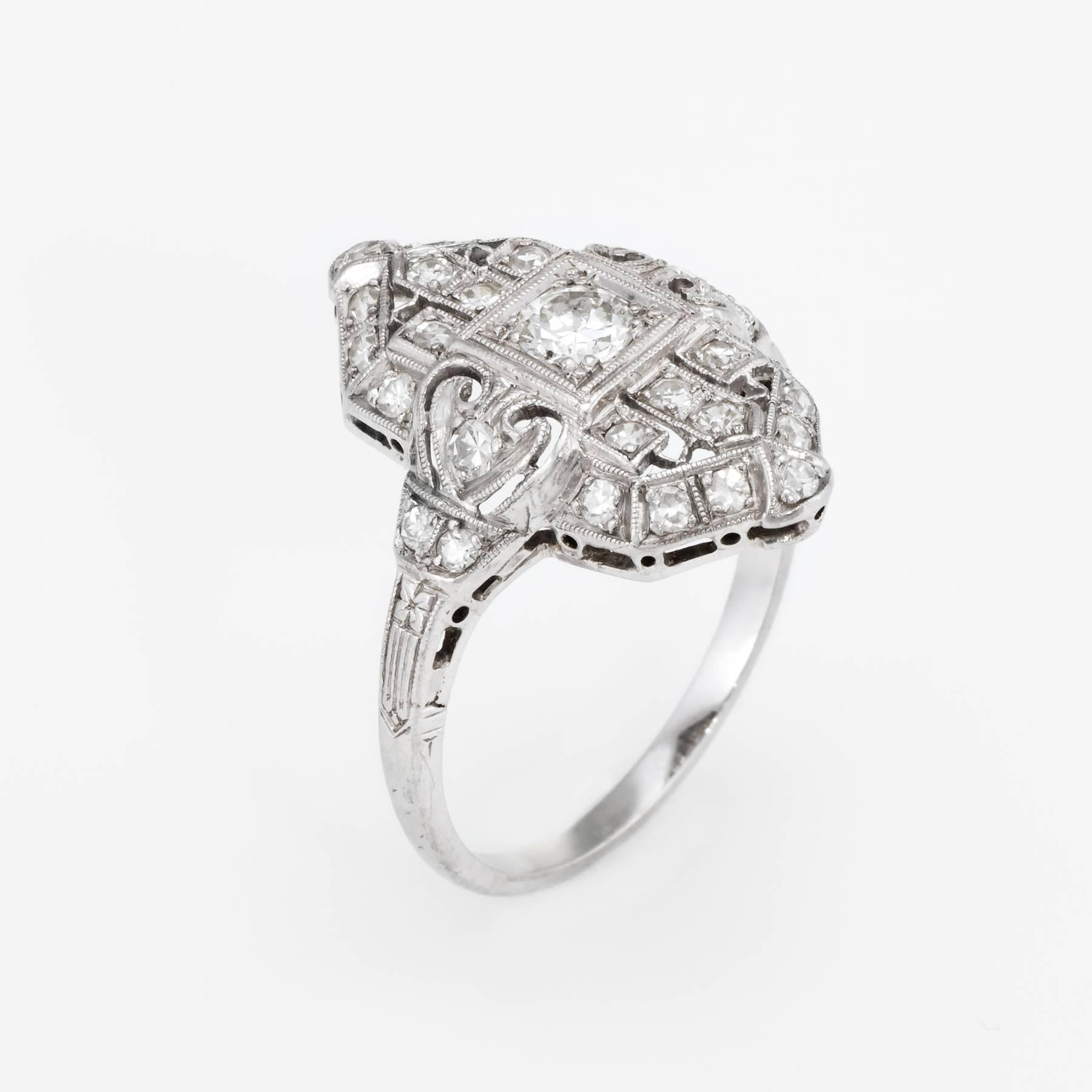 Finely detailed vintage Art Deco era ring (circa 1920s to 1930s), crafted in 900 platinum. 

Centrally mounted estimated 0.25 carat old European cut diamond is accented with an estimated 0.38 carats of single cut diamonds. The total diamond weight