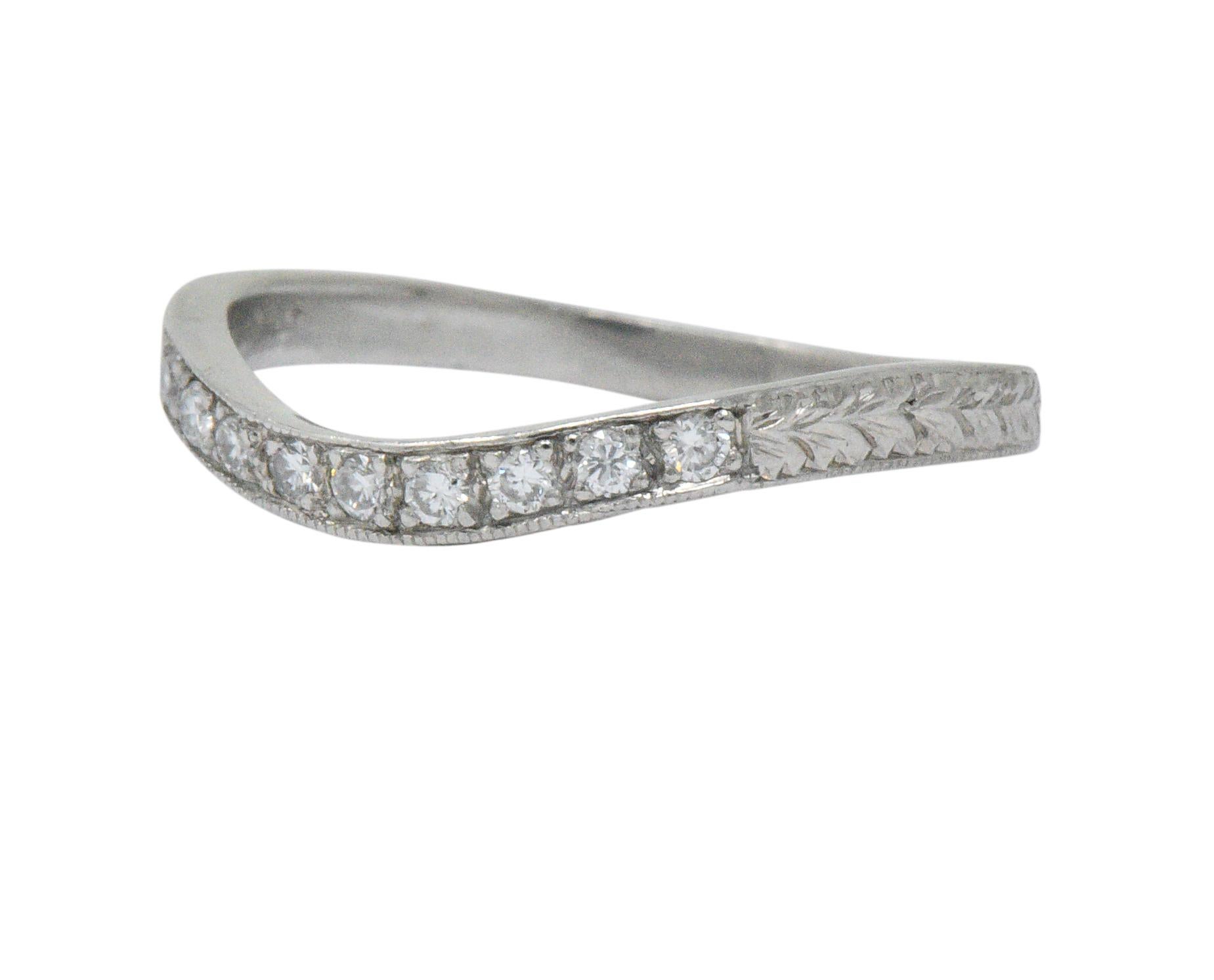 Contoured design and set to the front with full cut diamonds

Total diamond weight approximately 0.15 carat, eye clean and white

Engraved platinum shoulders and sides

Stamped RL 

CTW: 0.15

Ring Size: 5 1/2 & Sizable

Top measures 2.2 mm and sits