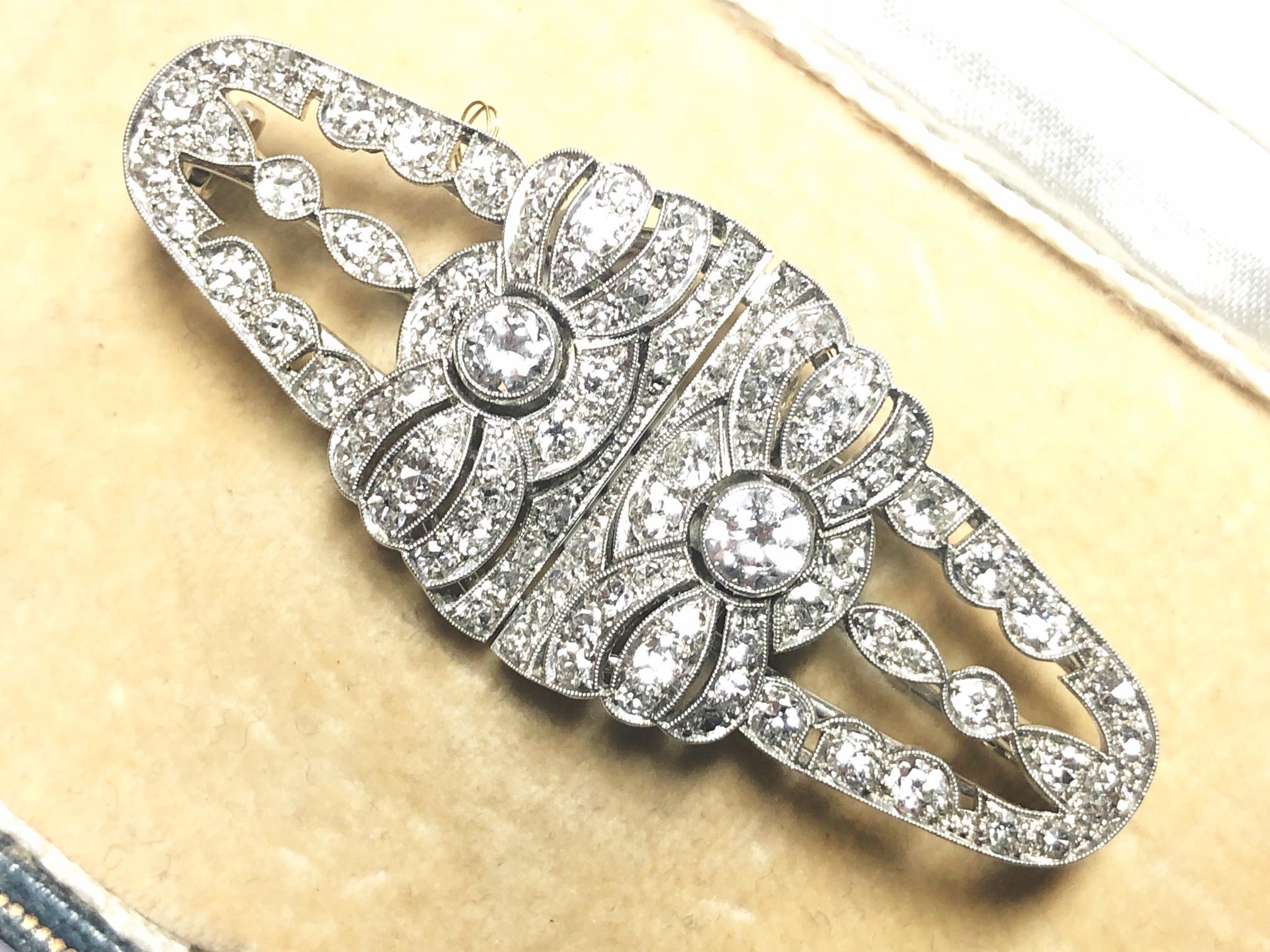 An Art deco double clip brooch, set with eight-cut, Swiss-cut, round brilliant-cut and Edwardian-cut diamonds, with an estimated total diamond weight of 2.15ct, mounted in platinum, with 14ct white gold clips and frame, with Austrian marks, horse