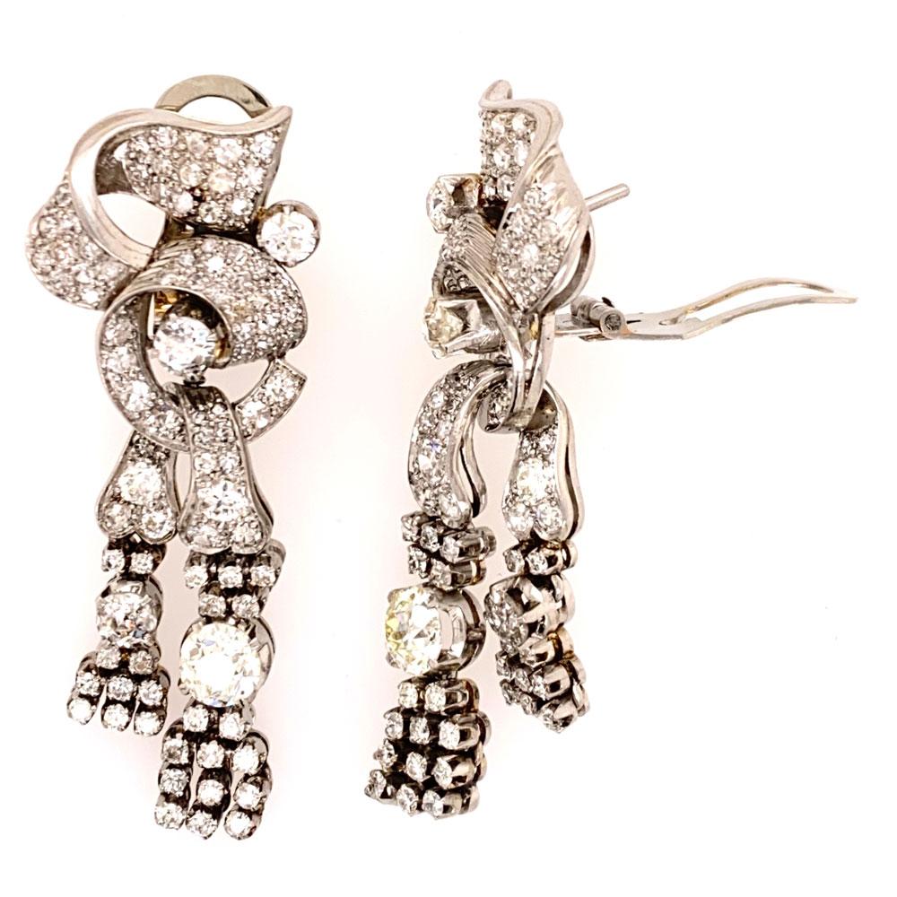 Art Deco Diamond Drop Earrings hand crafted in platinum. The diamond dangles feature 182 Old European Cut Diamonds in total. The two larger diamonds weigh approximately 1.50 carats, and the other 180 diamonds weigh 3.50 carats. The diamonds are