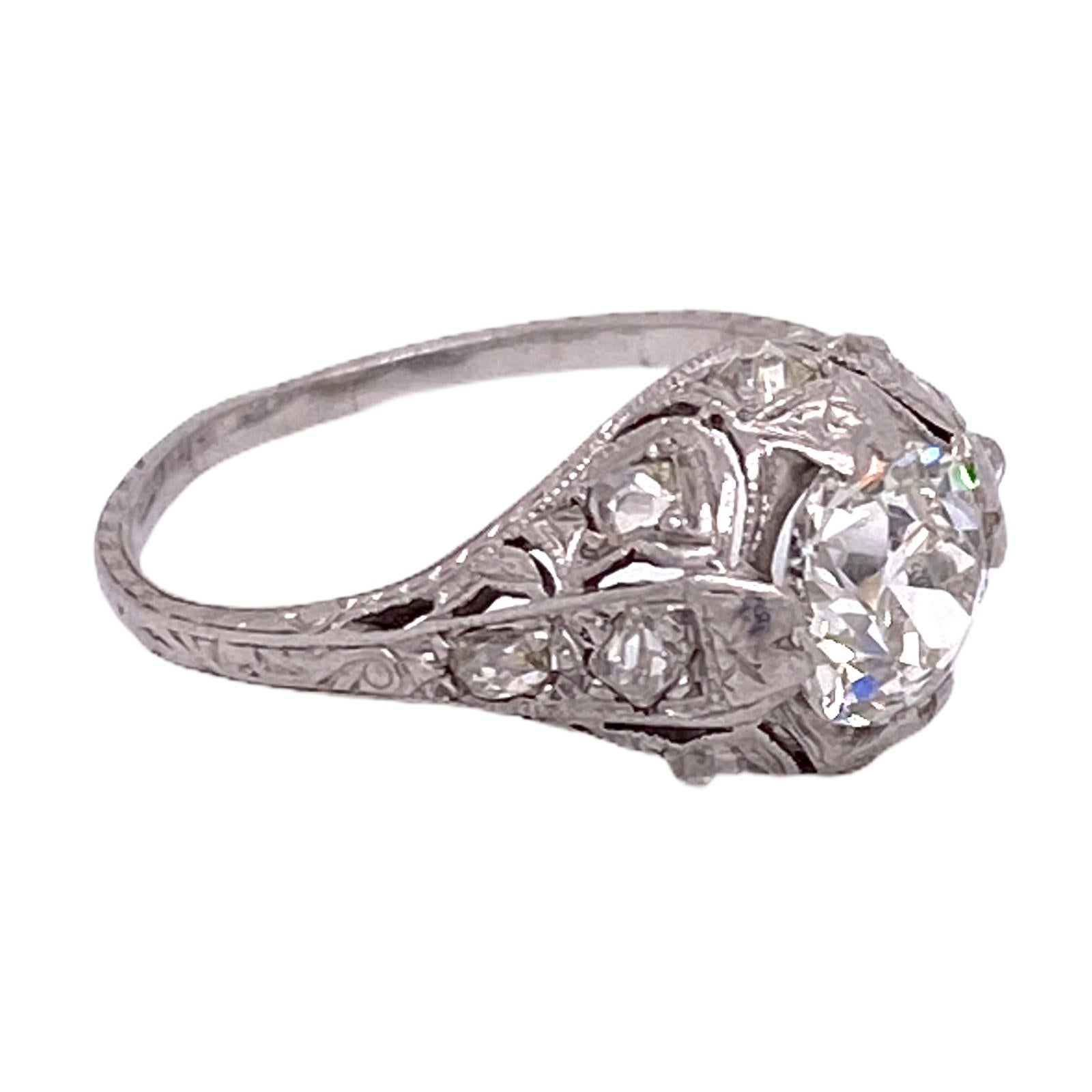 Beautiful Art Deco diamond engagement ring fashioned in platinum. The Old European cut diamond weighs approximately 1.10 carats and is graded I color and SI1 clarity (has not been removed from the mounting to send to the GIA). The filigree mounting