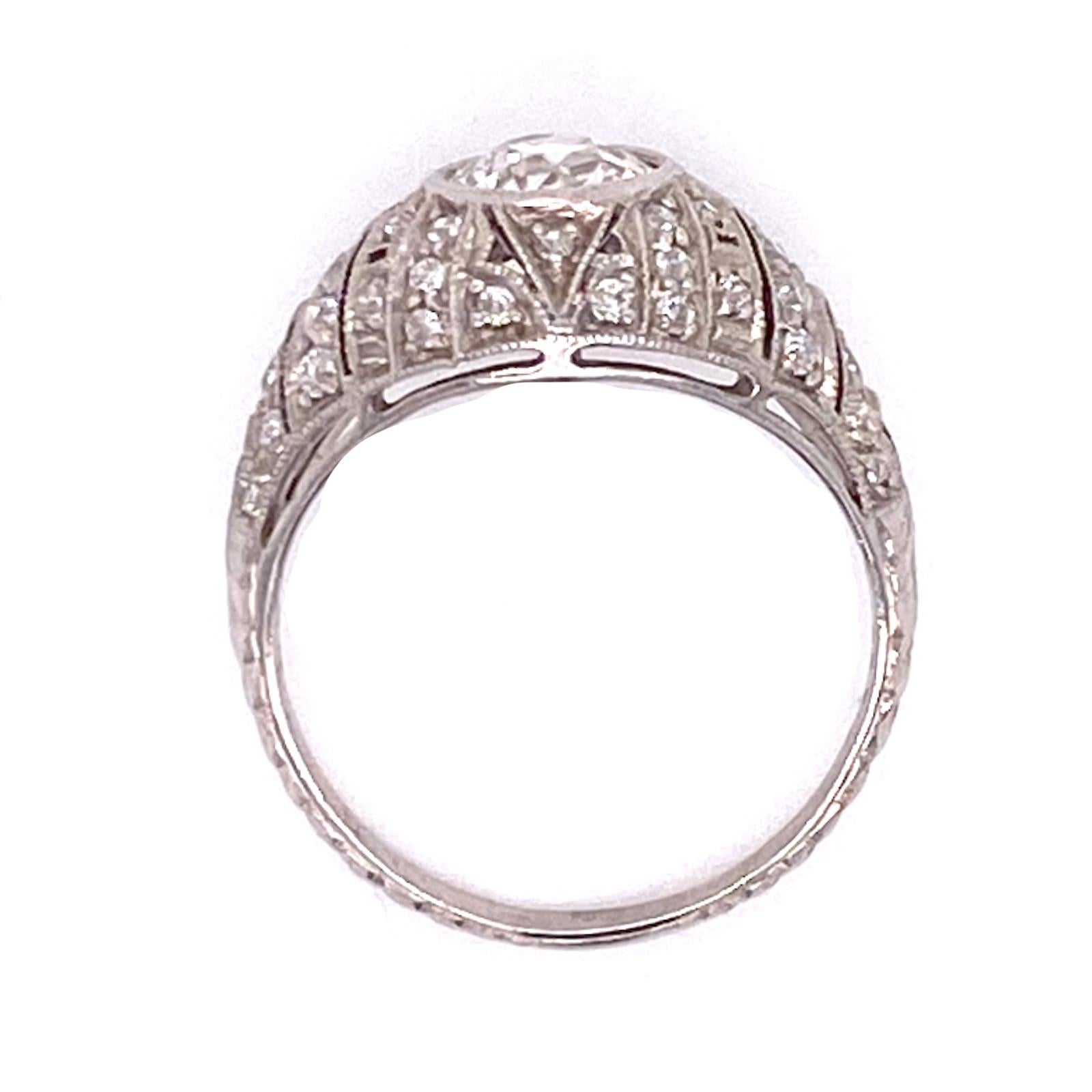 Beautiful Art Deco diamond engagement ring handmade in platinum. The Old European cut diamond weighs approximately 1.00 carat and is graded I color and SI1 clarity. The surrounding Old European cut diamonds in the mounting weigh approximately .50