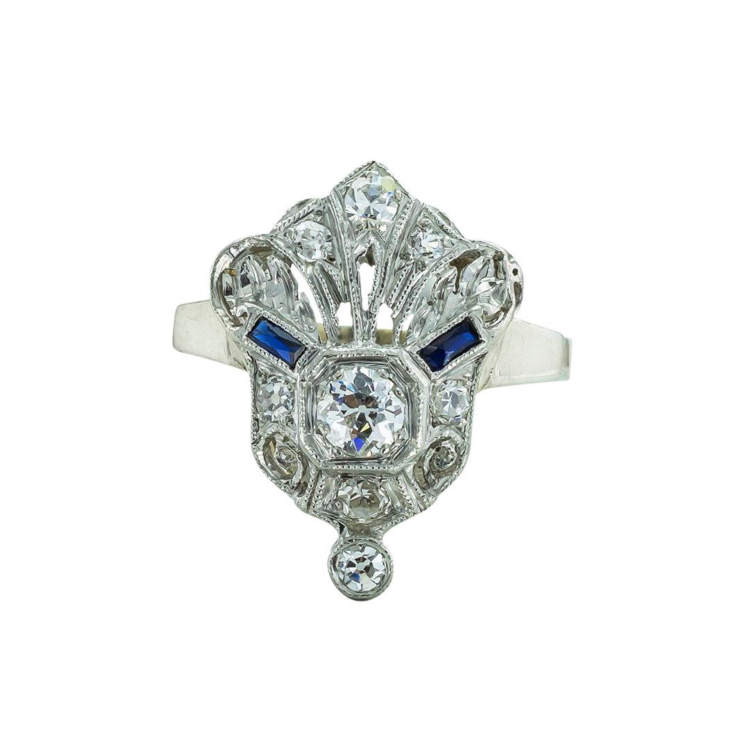 Art Deco diamond platinum and gold ring circa 1925. * 

ABOUT THIS ITEM:  #R-DJ817D. Scroll down for specifications.  The shield-shaped design is frosted on the top with both single-cut and old European-cut diamonds, allowing its low profile to