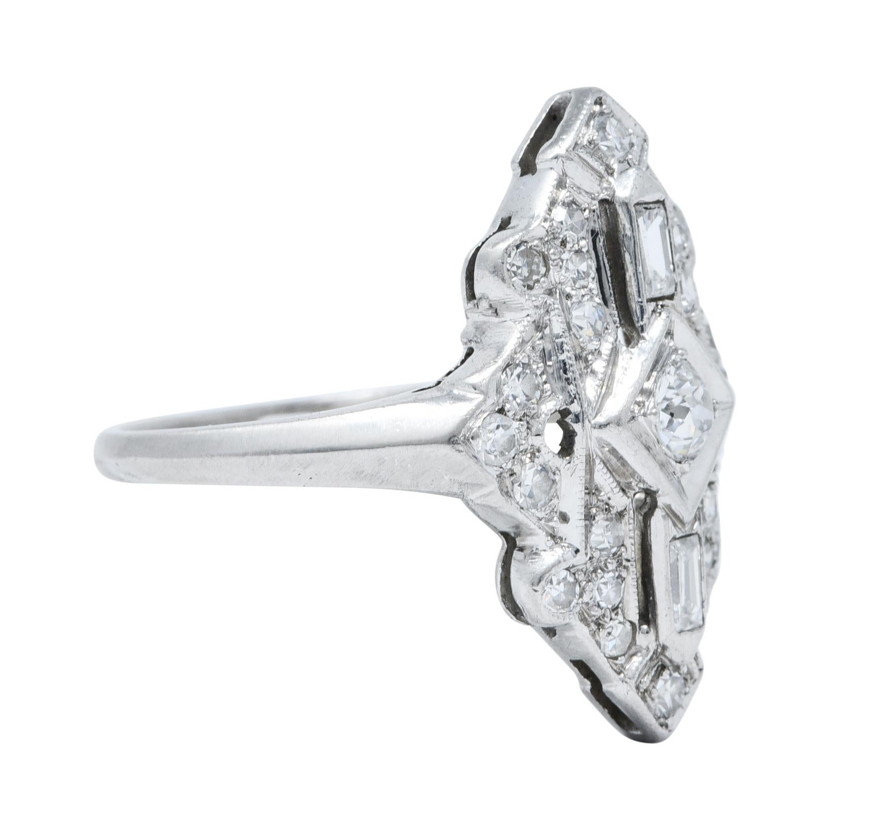 North/South dinner ring is geometrically styled and centers a navette form

Set with an old European cut diamond weighing approximately 0.15 carat - H/I color with SI2 clarity

Surrounded by baguette and single cut diamonds

Weighing in total