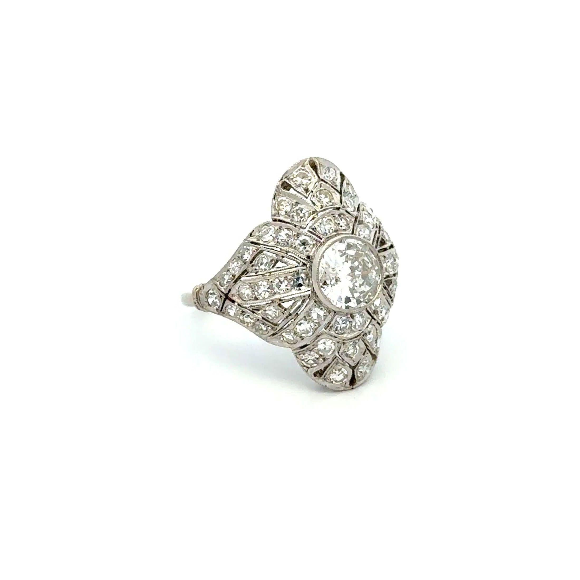 Simply Beautiful! Art Deco Diamond Platinum Vintage Cocktail Ring. Centering a securely nestled Hand set .88 Carat Transitional Diamond. Complimented by Diamonds, weighing approx. 1.00tcw. The ring is skillfully Hand crafted in Platinum. Measuring