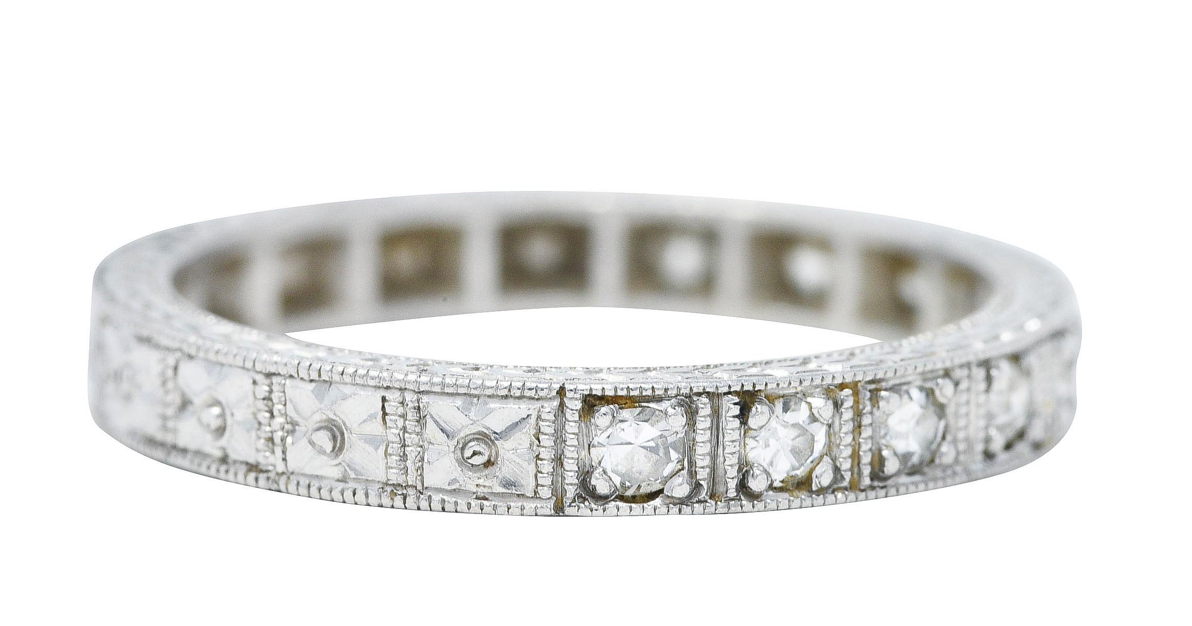 Band ring features single cut diamonds bead set to front with milgrain surround

Weighing approximately 0.25 carat total - eye clean and bright

Accented by engraved orange blossom motif shank

With engraved wheat motif profile

Tested as