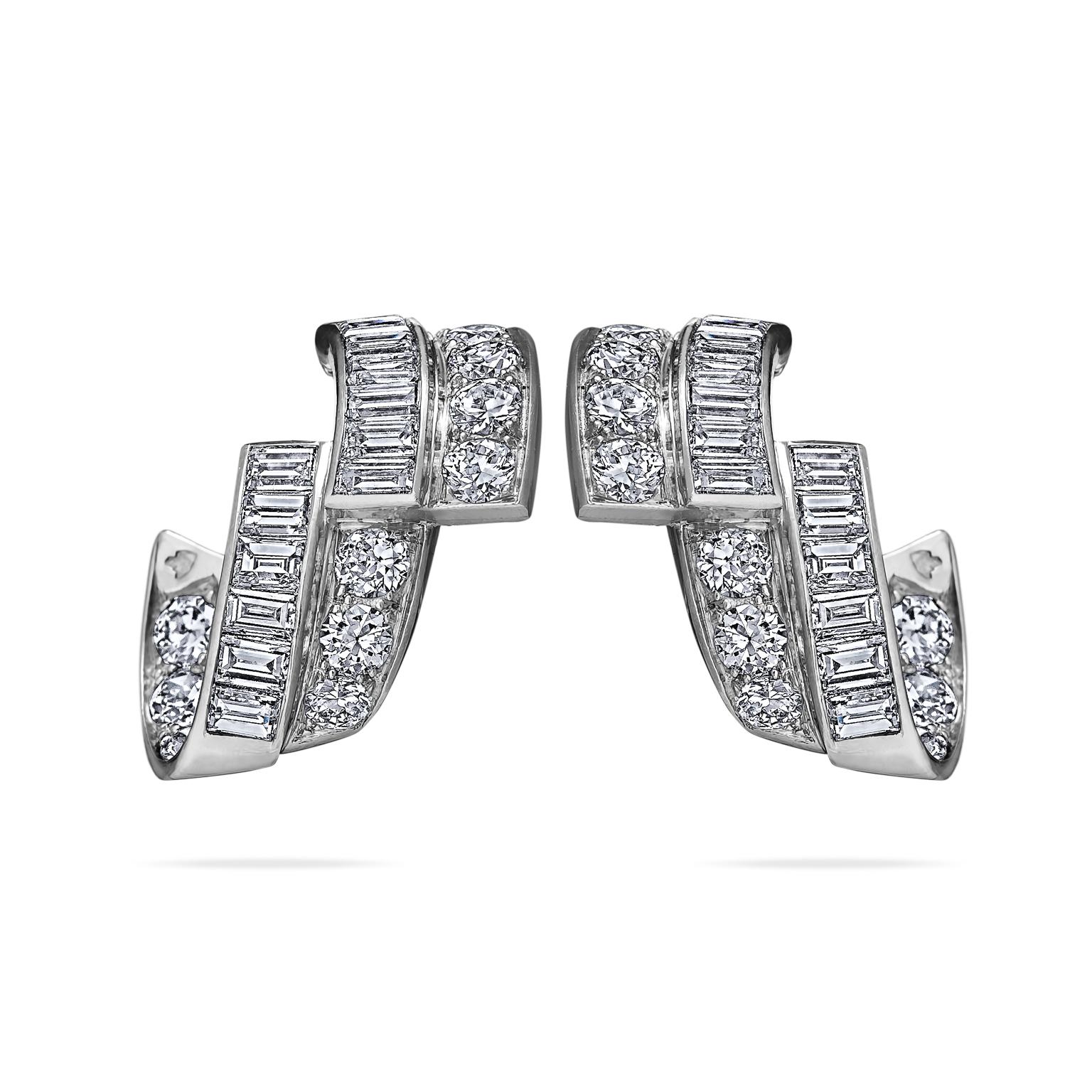 Ribbons of diamonds are endless in these one-of-a-kind French Art Deco earrings.  With 1.85 carats of cascading fiery baguette and old european cut diamonds mounted in platinum, these clip earrings evoke a bespoke era.  3/4