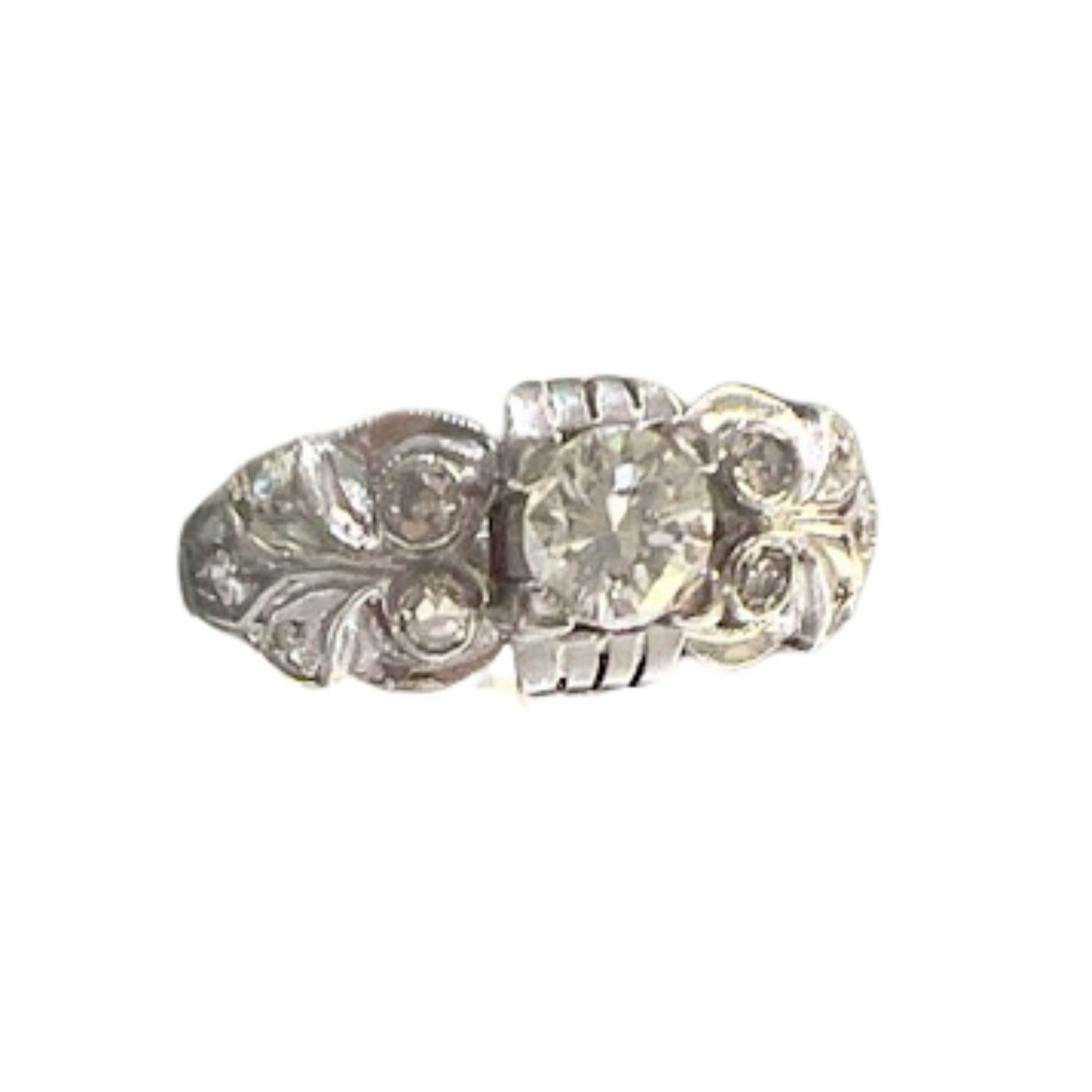 This Art Deco-inspired ring is crafted in platinum 950 and features Diamonds in a classic design. 

It has a weight of 5.9 grams and is sized 19.5/59.5. 

Central Brilliant-Cut Diamonds: 0.50 ct, VS Clarity, H-G Color (1 piece)

Remaining Simple-Cut