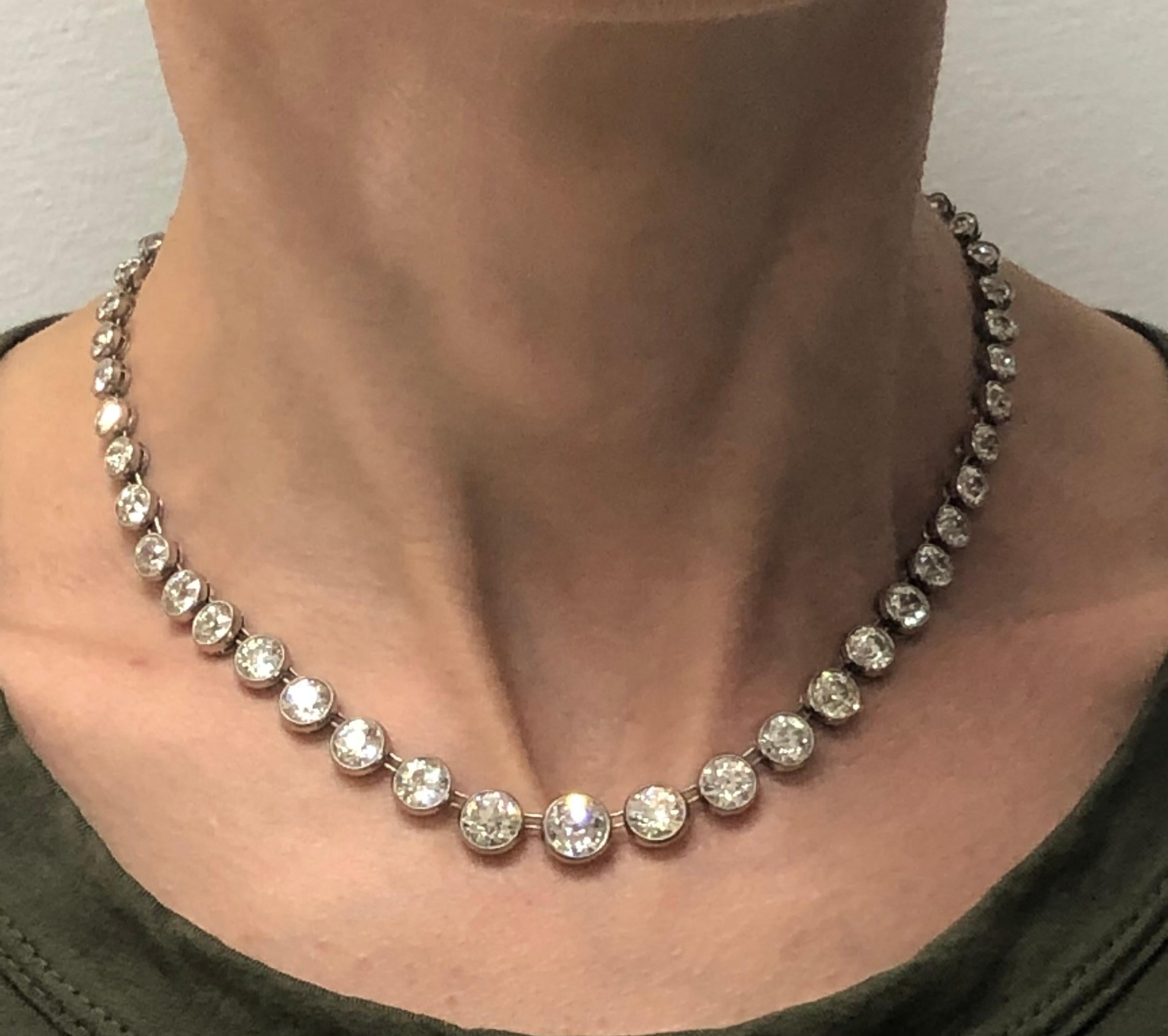 Gorgeous classy and timeless diamond riviere necklace created in the 1920s. Features sixty one Old European cut diamond set in platinum. The diamonds are graduating from 1.75 J/VS2 carat in the center to 0.07 carat towards the clasp (including two