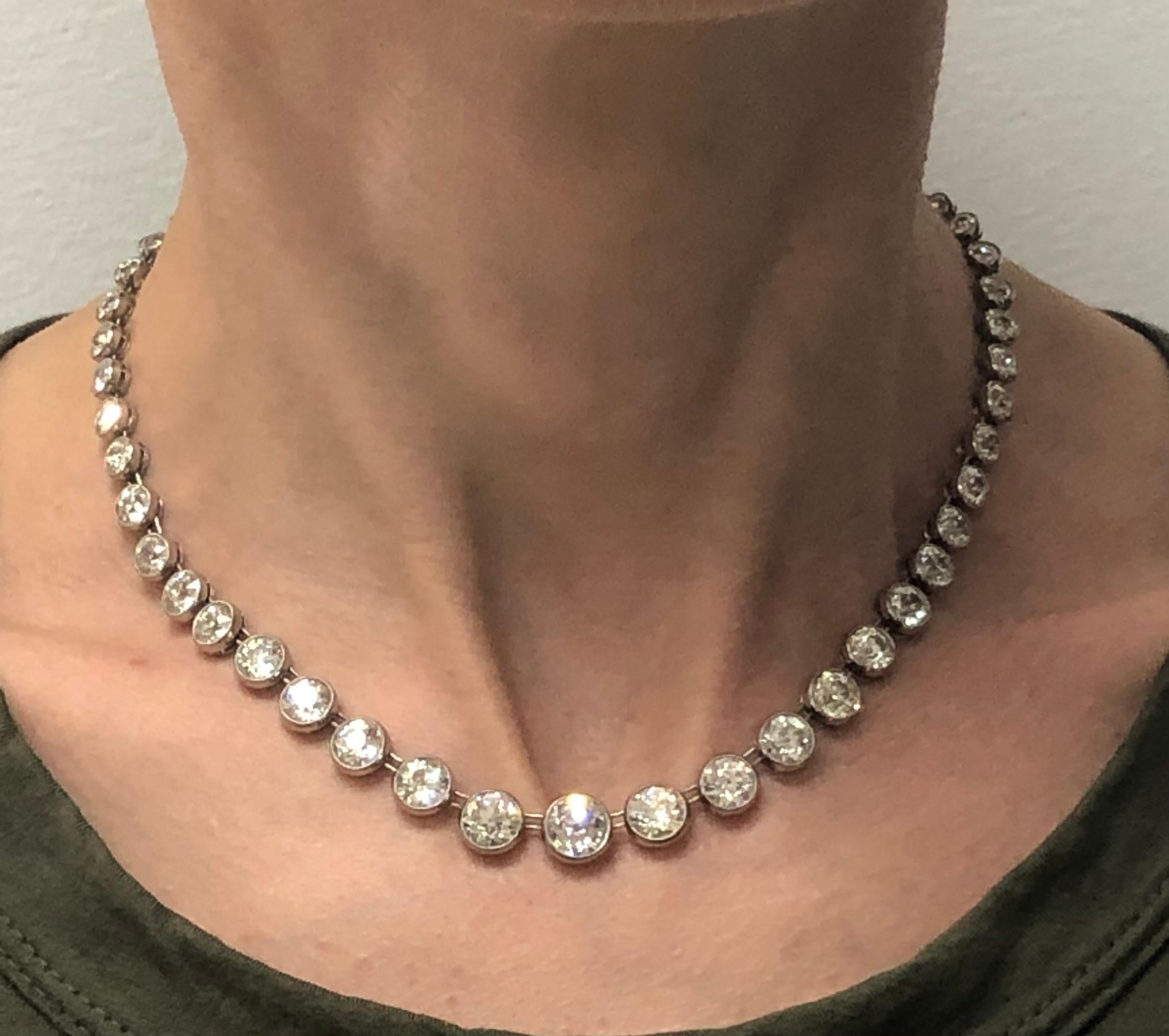 Gorgeous classy and timeless diamond riviere necklace created in the 1920s. Features sixty one Old European cut diamond set in platinum. The diamonds are graduating from 1.75 J/VS2 carat in the center to 0.07 carat towards the clasp (including two