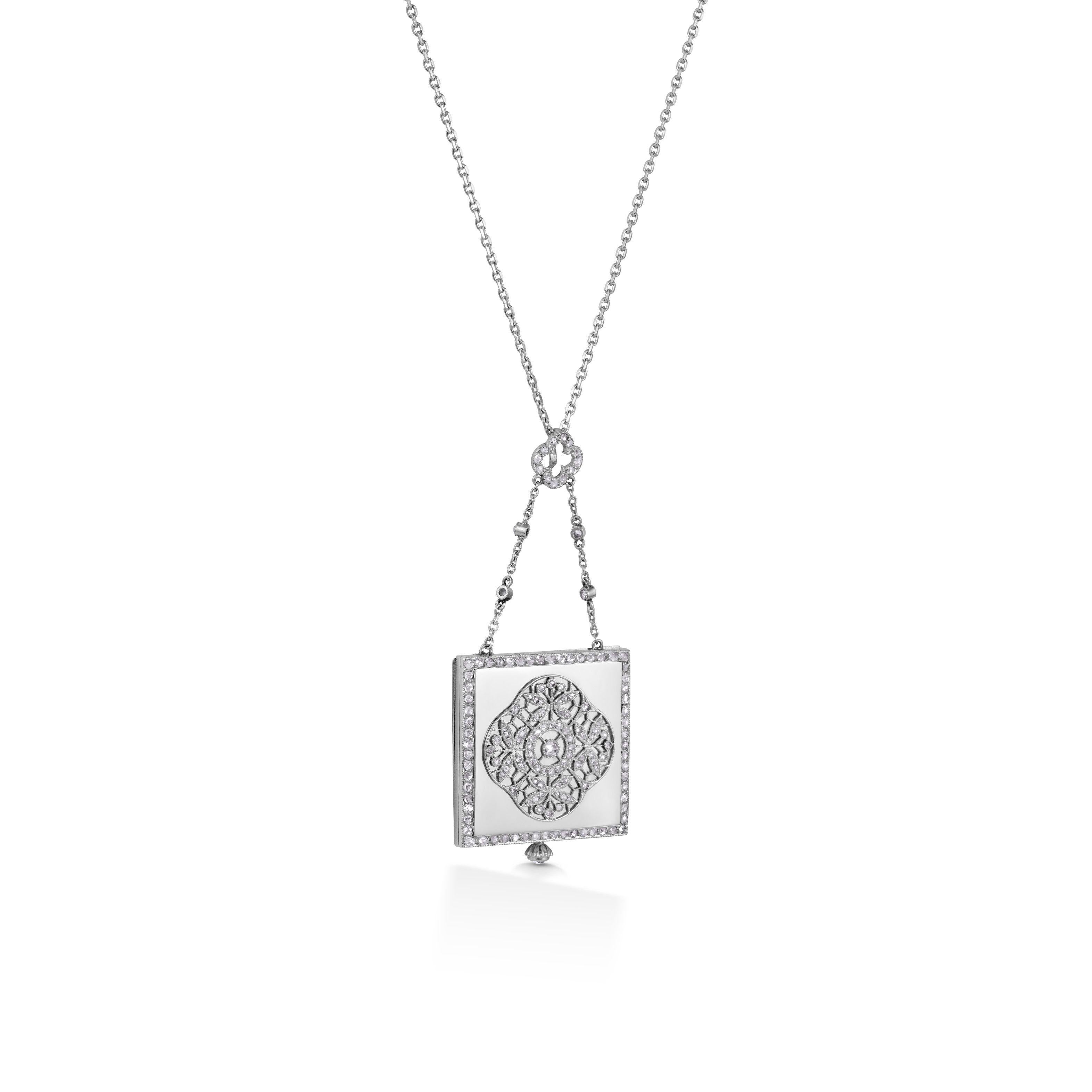 Simply Beautiful! Art Deco Diamond and Gold Reversible Watch Necklace Pendant; suspended from a 14K White Gold Chain. Hand set with Diamonds, weighing approx. 0.56tcw. Circa 1930s. Hand crafted in 14K White Gold. The watch is fully functional. More