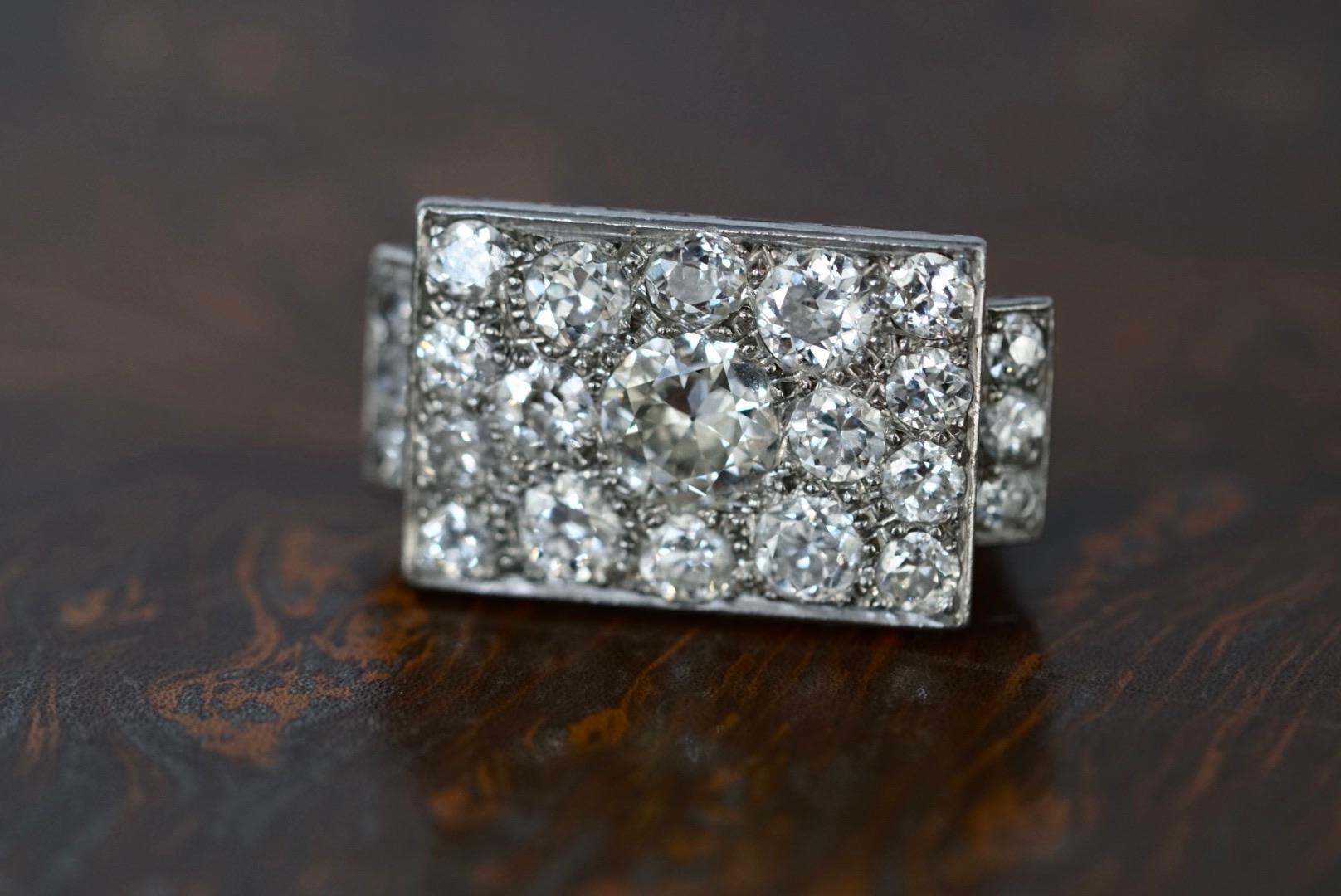 A fabulous Art Deco diamond plaque ring. Set in platinum, this ring sits wonderfully flat to the finger and really comes alive when worn. 