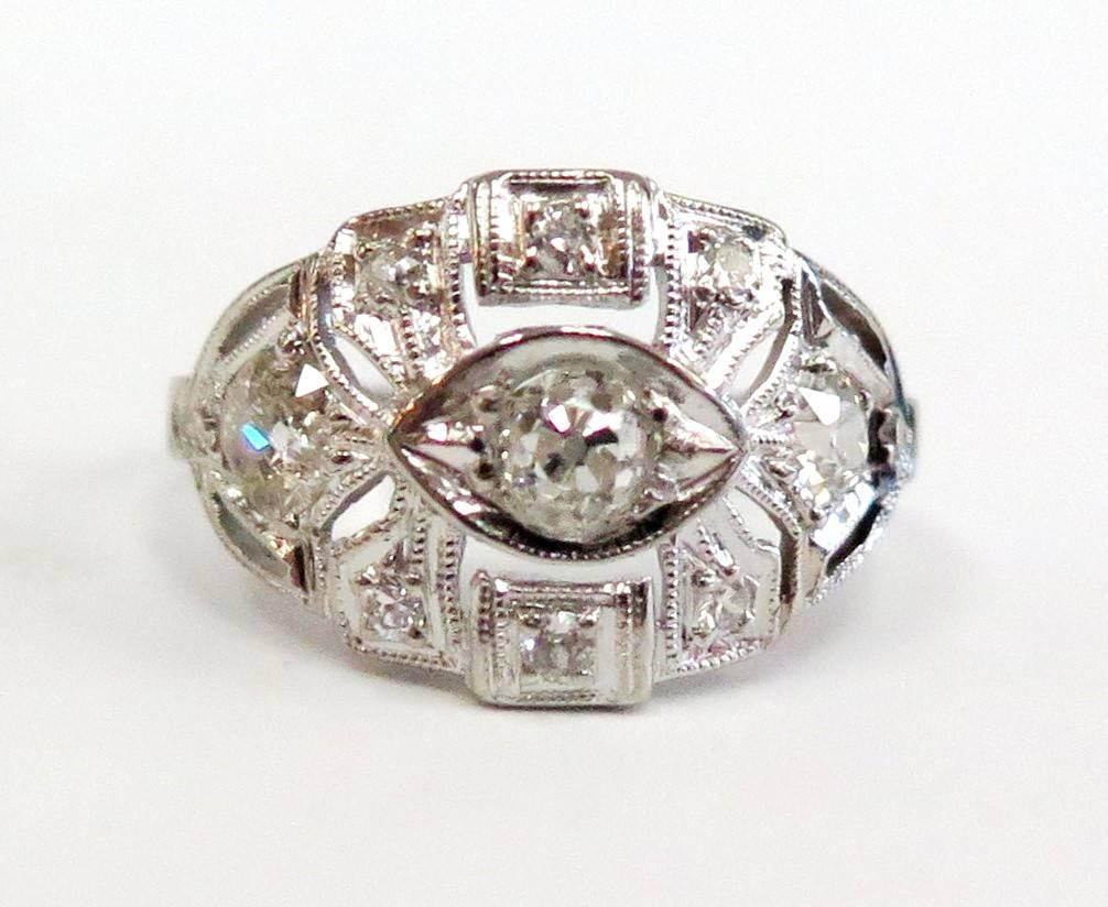 Platinum Art Deco Diamond ring, total weight: 0.68 Carat

One Old European Cut (Center Diamond), 4mm., weight estimated at 0.24 Carat, Color: H-I, Clarity: VS
Two Old European Cut, 3.5mm., weight estimated at 0.15 Carat each, total 0.30 Carat,