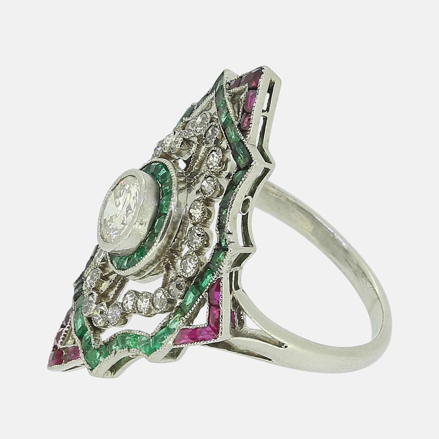 Here we have an exquisite dress ring crafted during the Art Deco movement. This platinum piece features a single round faceted old European diamond at the centre of an open face. This principal stone sits slightly risen whilst being encircled by a