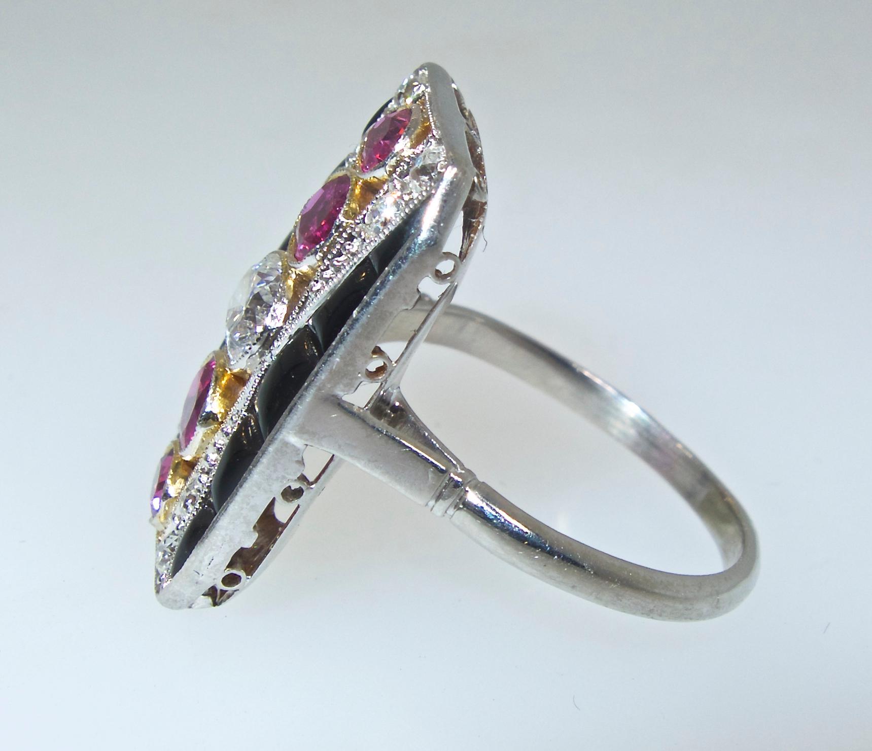 Art Deco platinum ring - fine condition and authentically a period piece - which is rare fine among so many reproductions.  The rubies are Burmese, natural and unheated and weigh approximately .75 cts., they are set in 18K yellow gold.    The fine