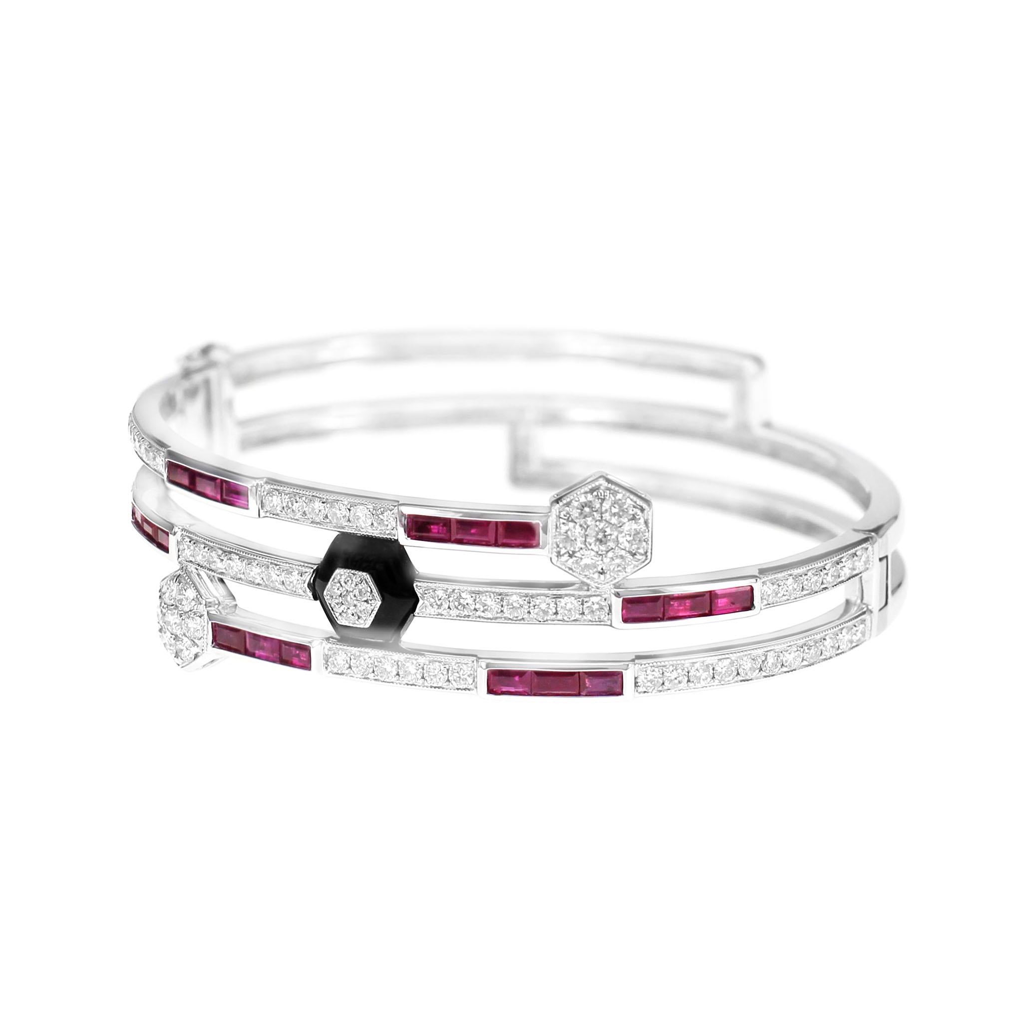 A stunning combination of ruby, onyx and white round diamond are assembled together to create this master piece art deco style design. The bangle is a Malpani recommended design as it sits beautifully on your wrist. 
The details of the diamond are
