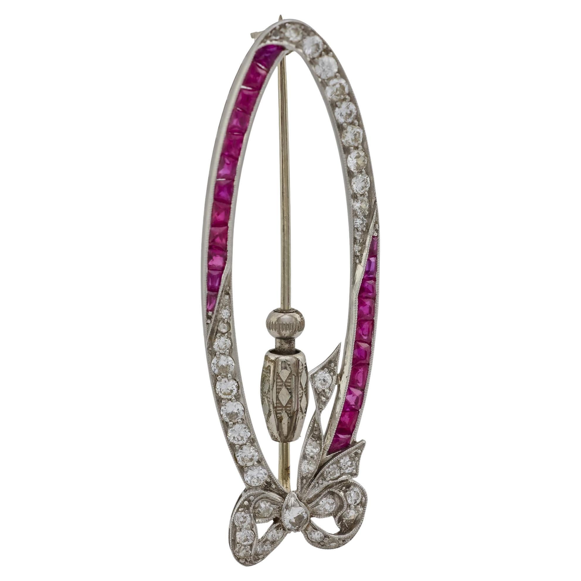 Art Deco diamond ruby platinum oval bow brooch For Sale