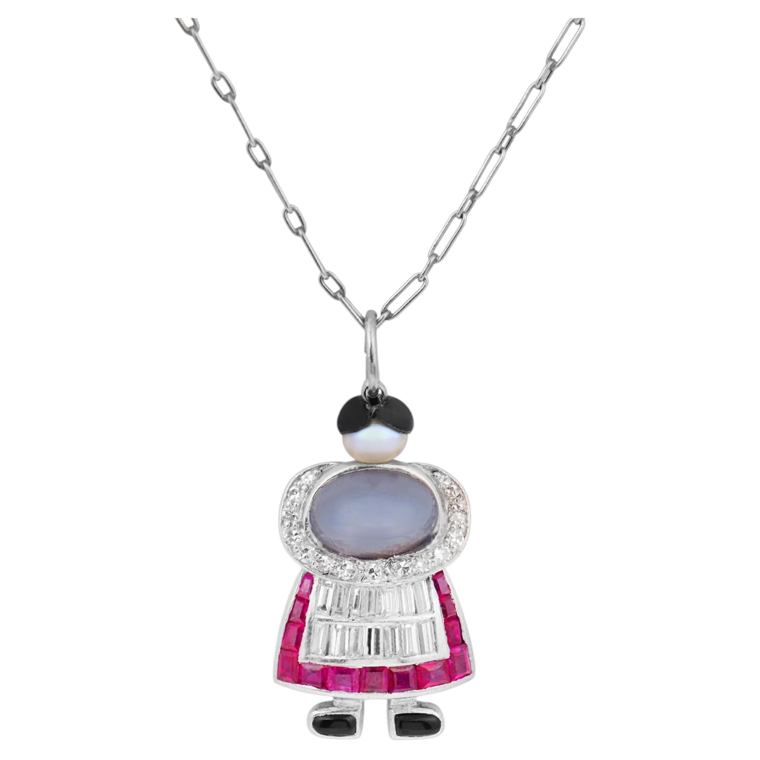 Art Deco diamond ruby star sapphire platinum charm necklace For Sale
