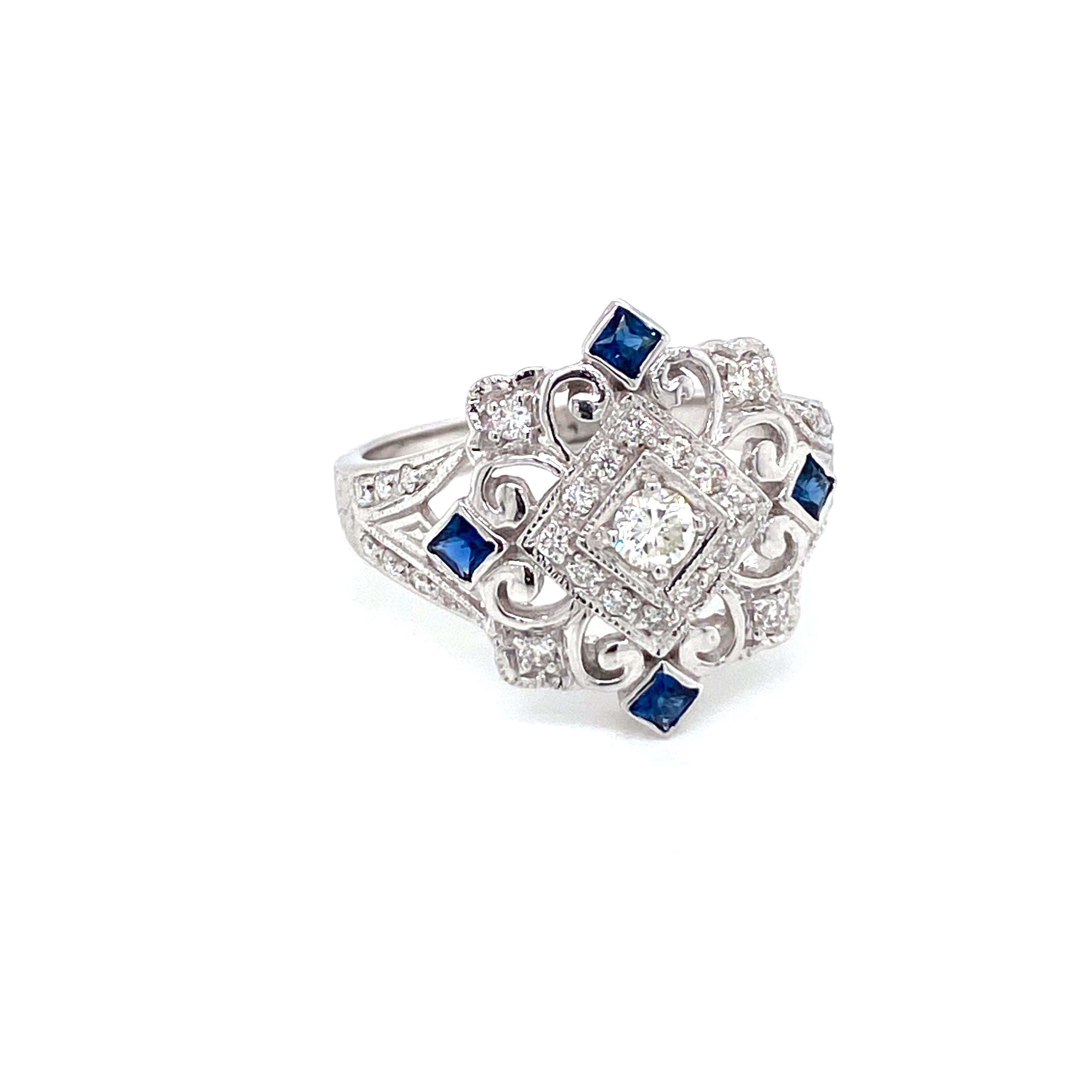 Beautiful Gold handmade Art Deco style ring, the mount features a fine filigree and engraving work.
It is set in 14k white Gold featuring Natural Sapphires custom cut and sparkling Round brilliant cut diamonds, total weight 0,50 ct. G color VVS1