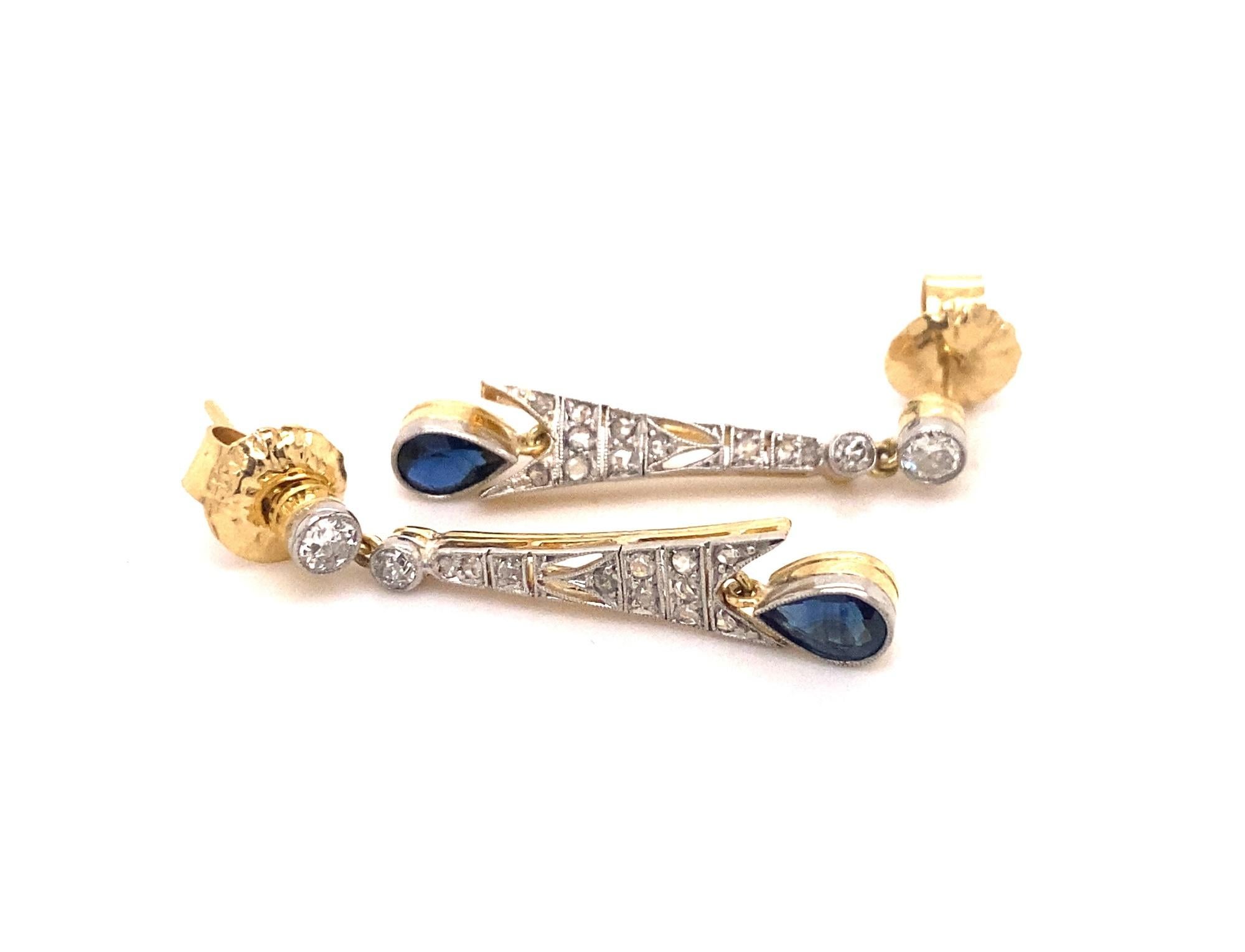 This is a beautiful pair of art deco earrings set with pear shape natural sapphires and diamonds in platinum with 18K gold backs. There are 18 rose cuts and 4 old mine cut diamonds I color VS-2 clarity total weight .70 carats. The pear-shaped