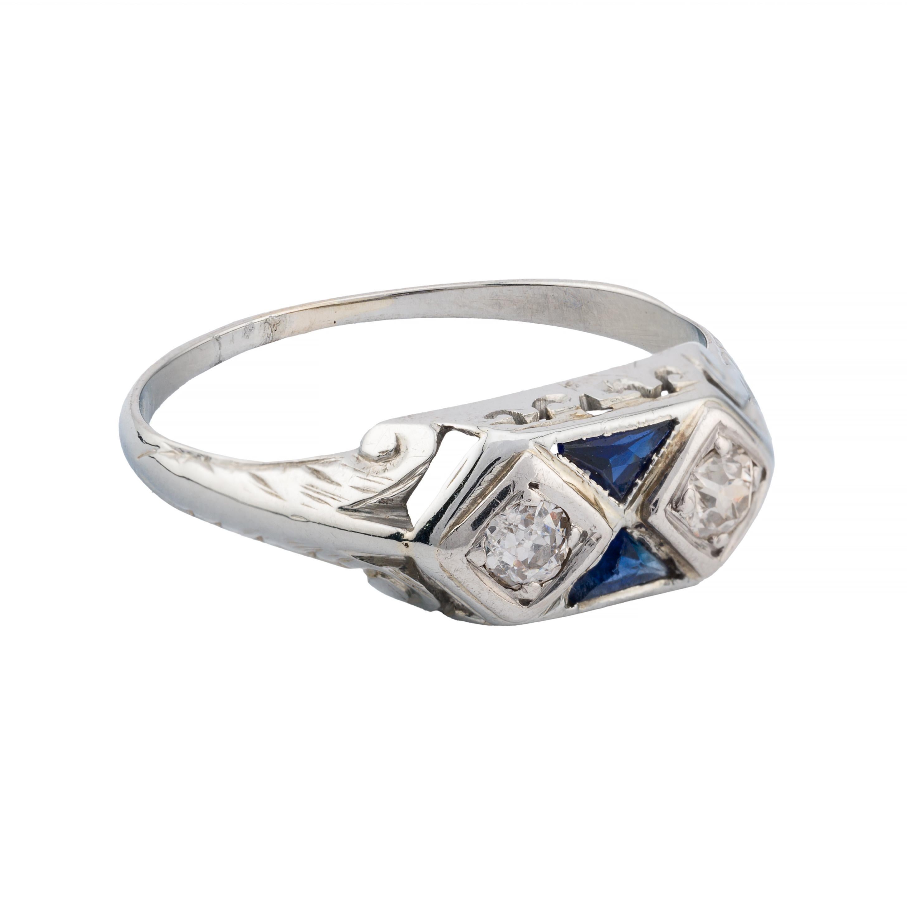 Aston Estate Jewelry Presents:

A captivating art deco ring featuring a pair of 0.30 ctw European cut diamonds of VS2 clarity with H color. The diamonds are elegantly set alongside two French cut blue sapphires,  weighing 0.20ctw, adding a striking