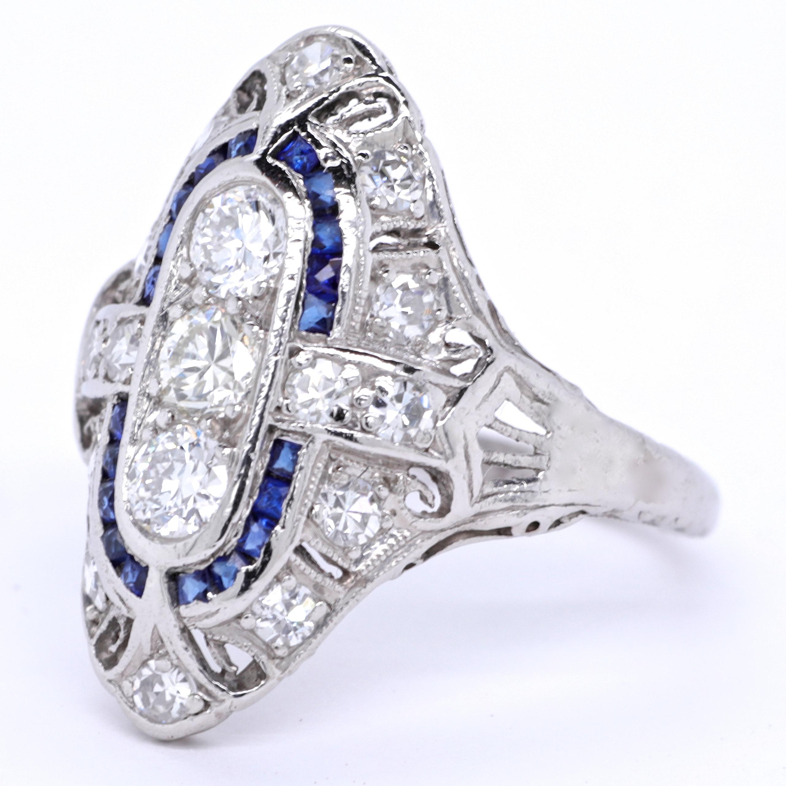 Imagine wearing a work of art on your finger. Something you can look at and enjoy everyday. This stunning Art Deco Diamond Sapphire  Navette Platinum Ring will give you pleasure for years to come. It features 3 old European cut diamonds