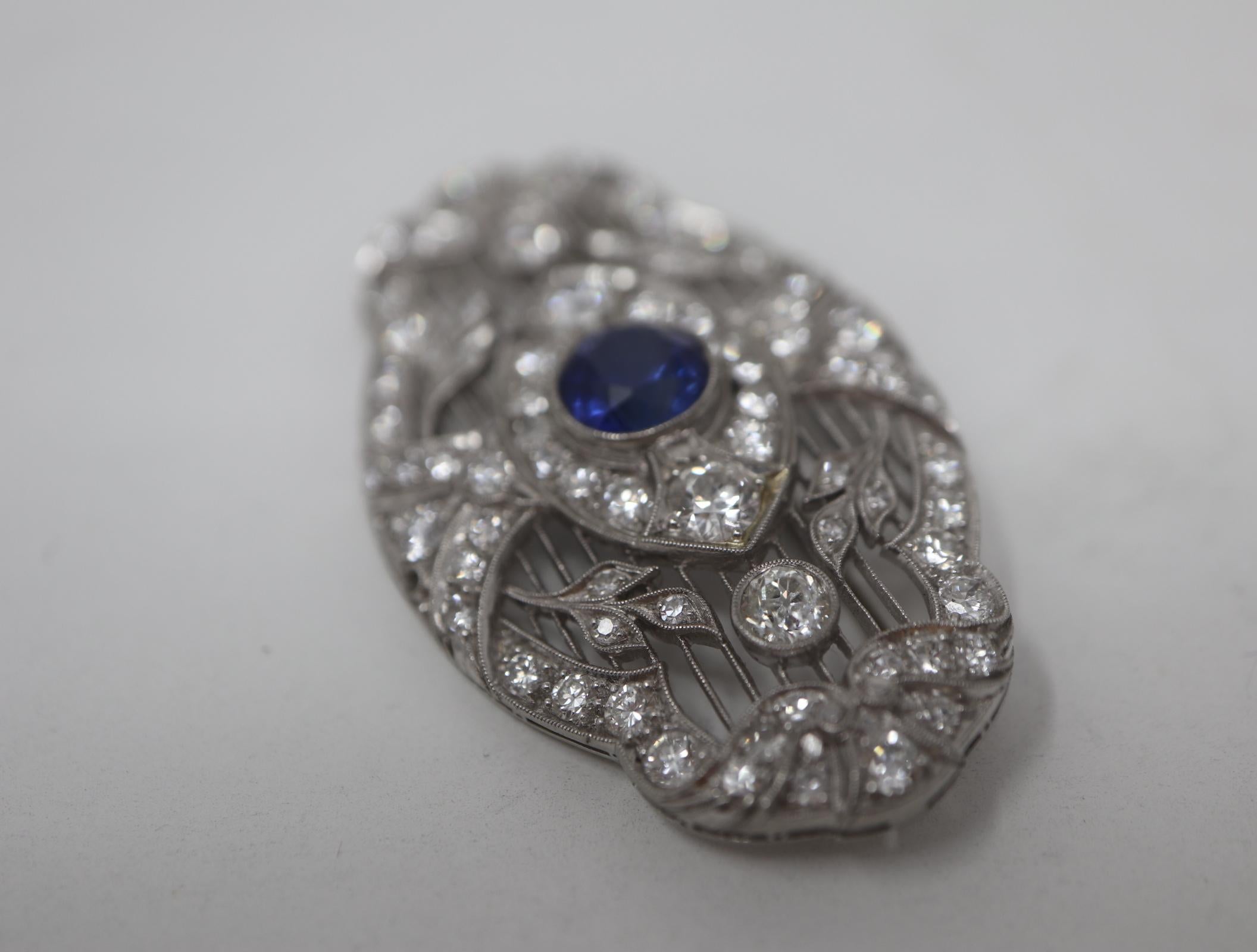 Women's Art Deco Diamond & Sapphire Platinum Filigree Brooch For Sale