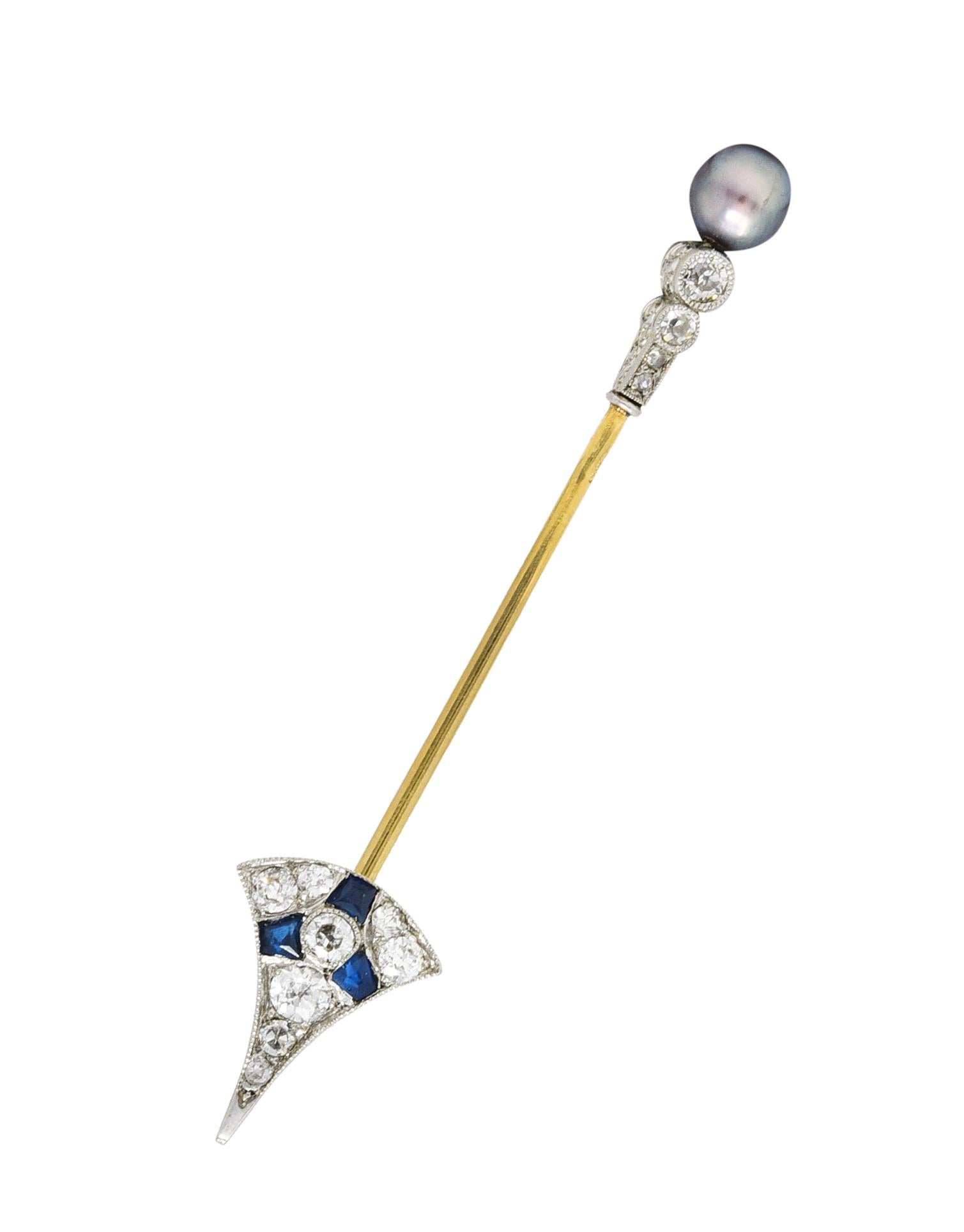 Arrow jabot bar brooch is designed as a gemmed arrowhead and stylized gemstone fletching. Arrowhead is pavé set with old European cut diamonds and a triad of calibrè cut sapphire. Fletching is multi-sided and exhibits profile engraving, calibré cut