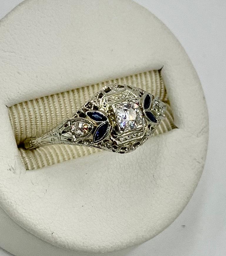 A stunning Antique Art Deco - Edwardian Diamond and Sapphire Wedding Ring Engagement Stacking Ring set with a gorgeous .25 Carat Old European Cut Diamond of brilliant white H color and VS clarity.  This is a very fine diamond with the incredible