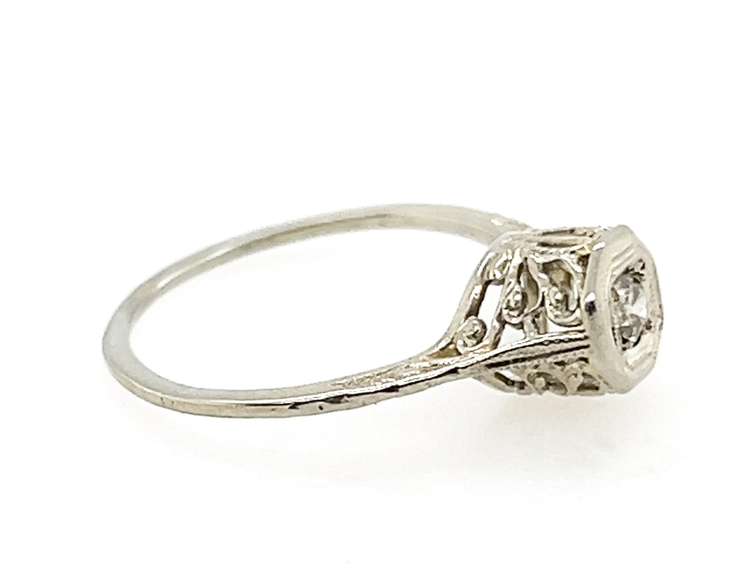 Genuine Original Antique from 1920-1930 Art Deco Solitaire Engagement Ring Old European Cut Diamond 18K White Gold 


Featuring a Genuine .12ct Natural Old European Cut Diamond Center

Circa 1920's-1930's

The Art Deco Era in Jewelry