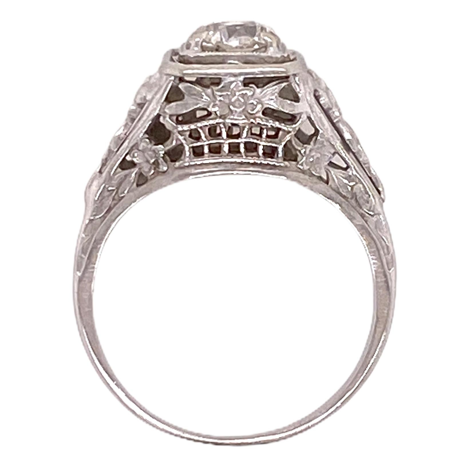 Stunning original Art Deco diamond engagement ring hand crafted in 18 karat white gold. The Old European Cut diamond weighs .59 carats and is graded I color and SI2 clarity by the GIA. THe GIA certificate number is 1182861095. The beautifully