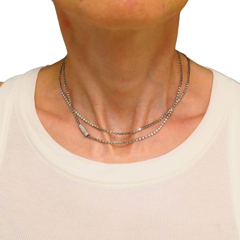 An elegant Art Deco diamond tennis necklace crafted in platinum. 
The tennis necklace comprises of a series of Old European cut diamonds, each individually bezel set. This design creates a sparkling effect that catches the light beautifully. The