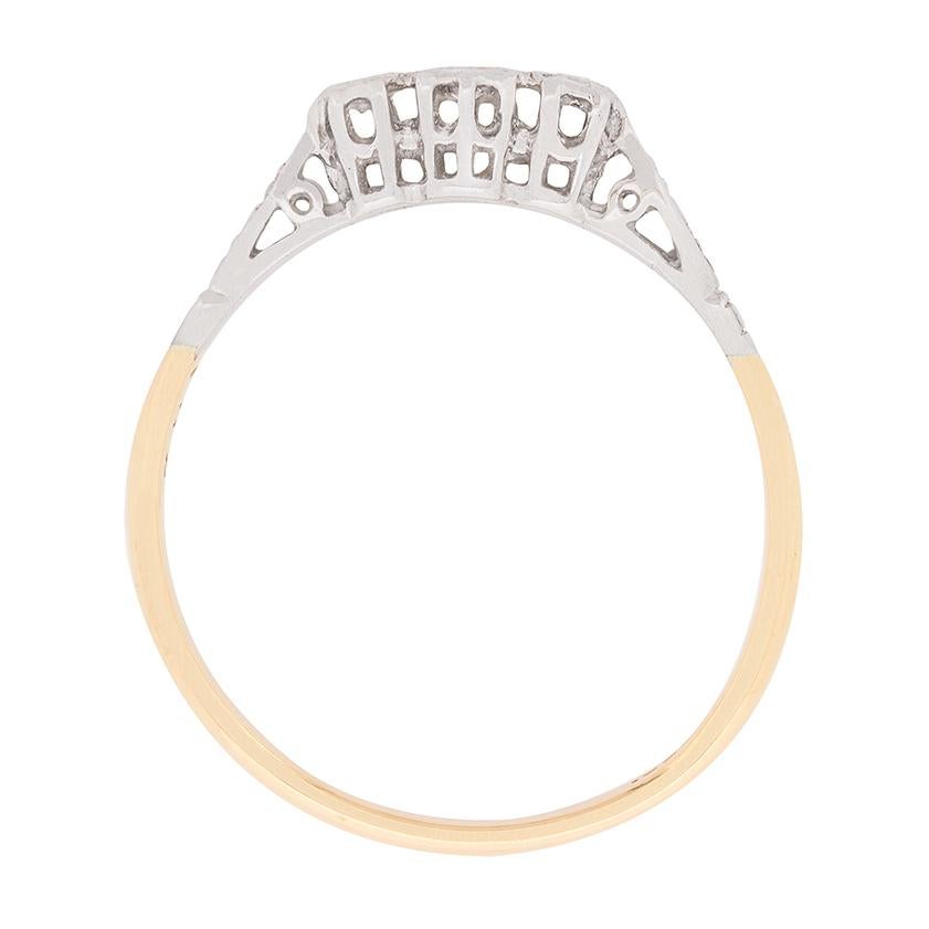 A delicate little ring ideal for engagement. It features three 8-cut diamonds, which have a combined weight of 0.11 carat. They are beautifully set within a wonderful hand crafted platinum top, which is full of character. The design has been hand