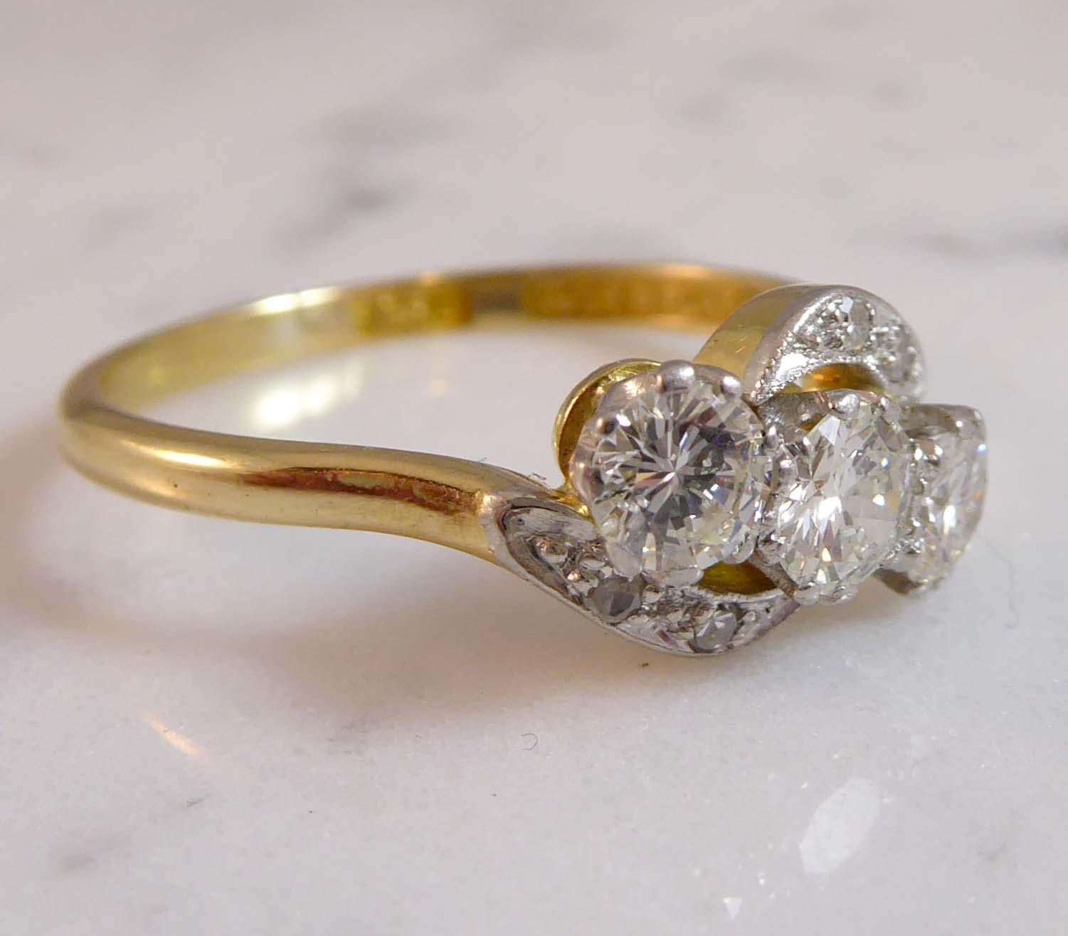 Round Cut Art Deco Diamond Three-Stone Ring, 0.74 Carat Cross-Over Twist Diamond Shoulders