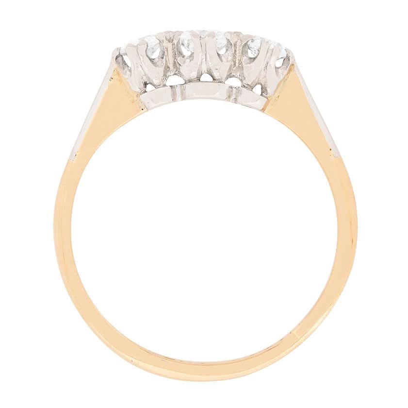 This three stone ring boasts a total weight of 0.50 carat diamonds. Colour grade is G and clarity of SI. The centre stone is 0.20 carat and is beautifully highlighted by the other two stones. The band the diamonds are claw set in, is rose gold and