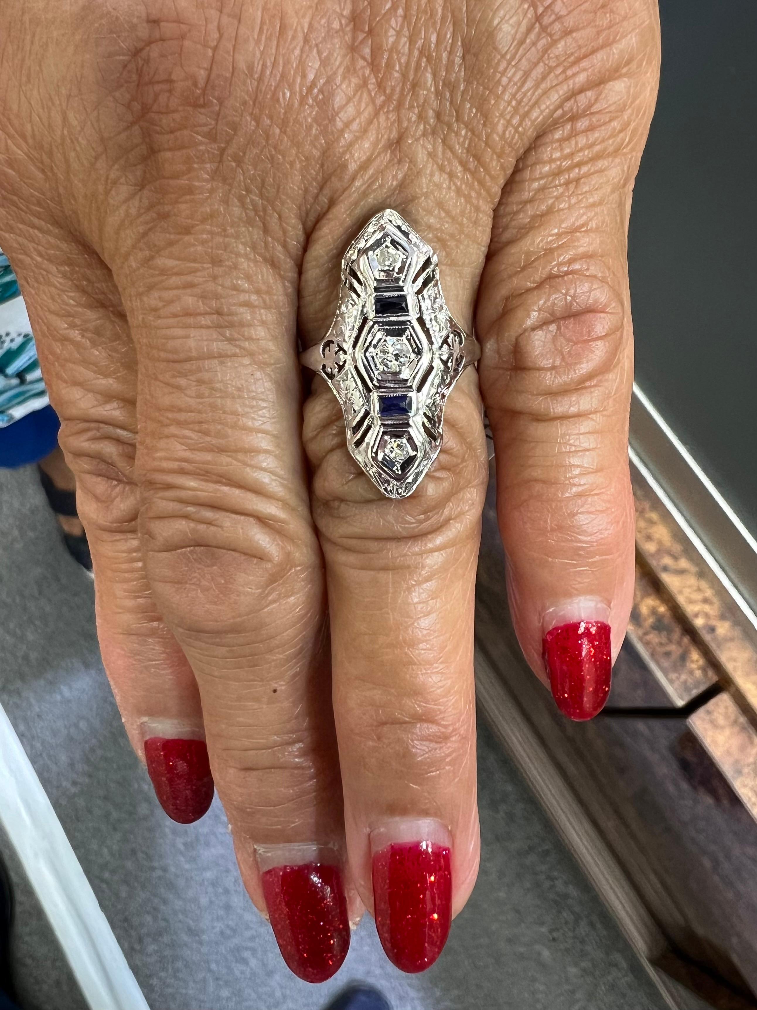 Art Deco Diamond white gold dinner ring, circa 1930s.

The Art Deco diamond white gold long dinner ring from the 1930s is set with 3 old round cut diamonds and two calibrated cut blue stones.

SPECIFICATIONS:

 DIAMONDS: 3 old round-cut diamonds