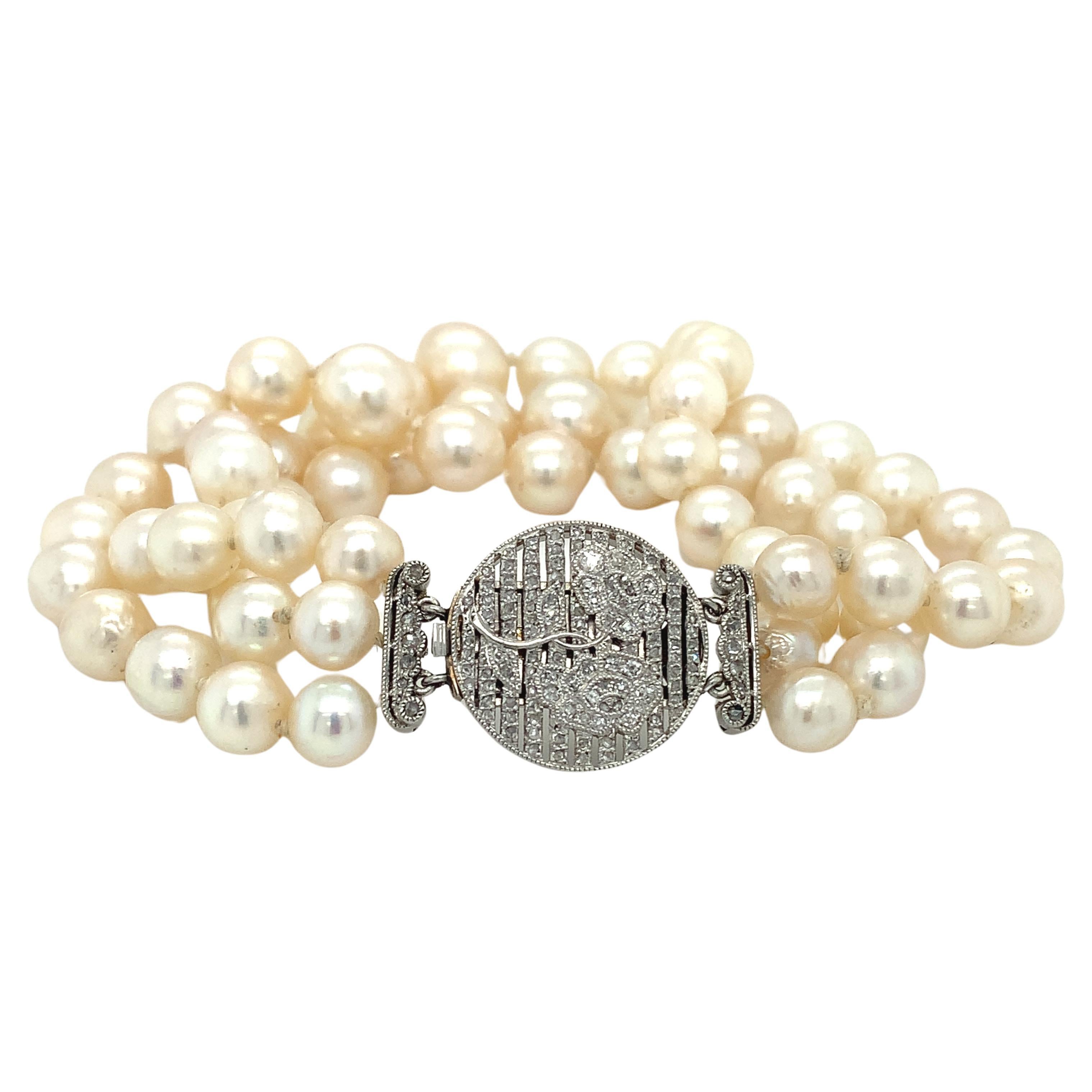 Bracelet Art déco à trois brins en platine, diamants et perles en vente