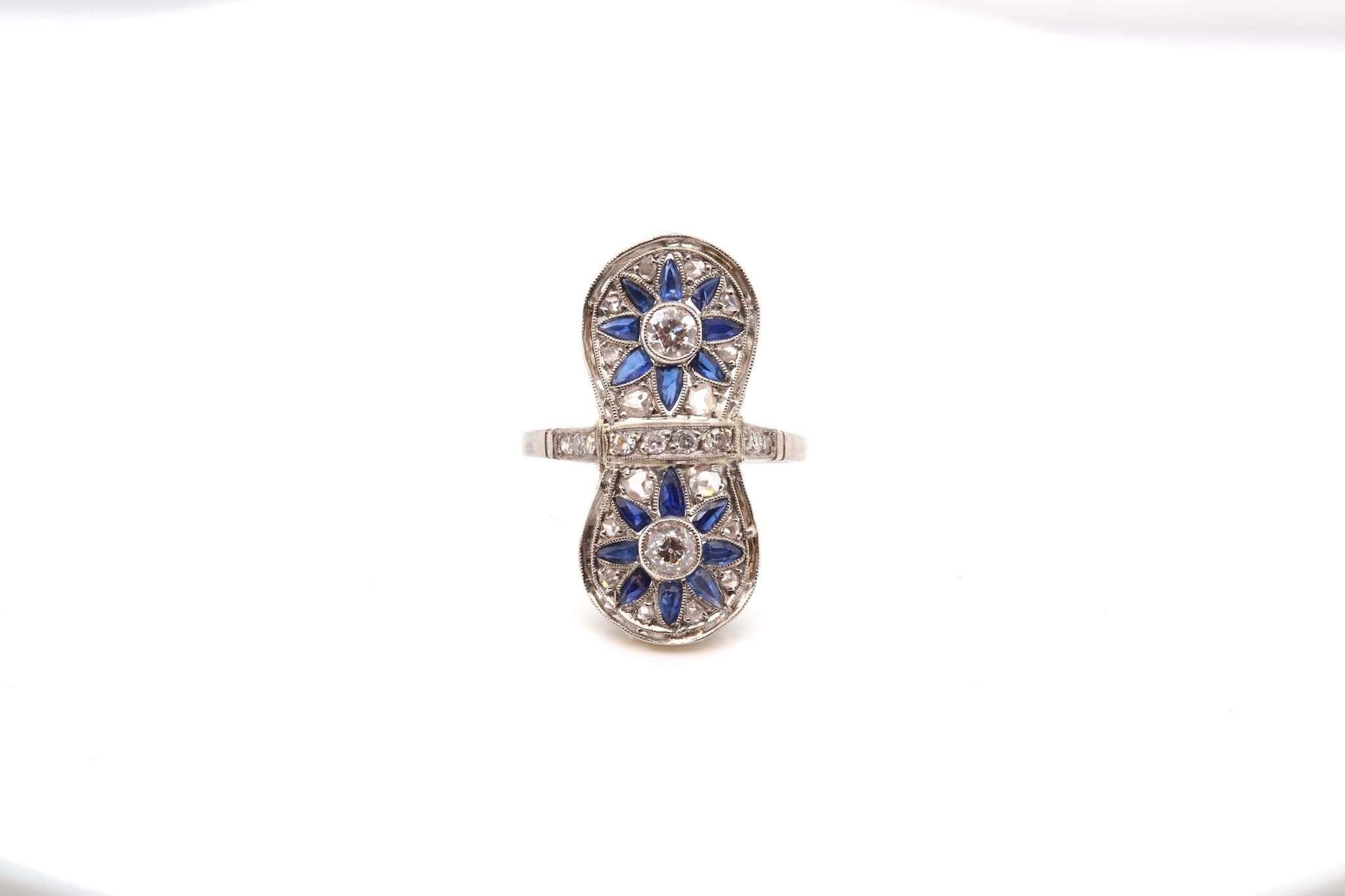 Stones: 2 diamonds of 0.30ct, entourage diamonds, weight: 0.80ct and calibrated sapphires
Dimensions: 2.7cm x 1.2cm
Material: Platinum
Weight: 4.8g
Finger size: 55 (free sizing)
Certificate
Ref. : 24986