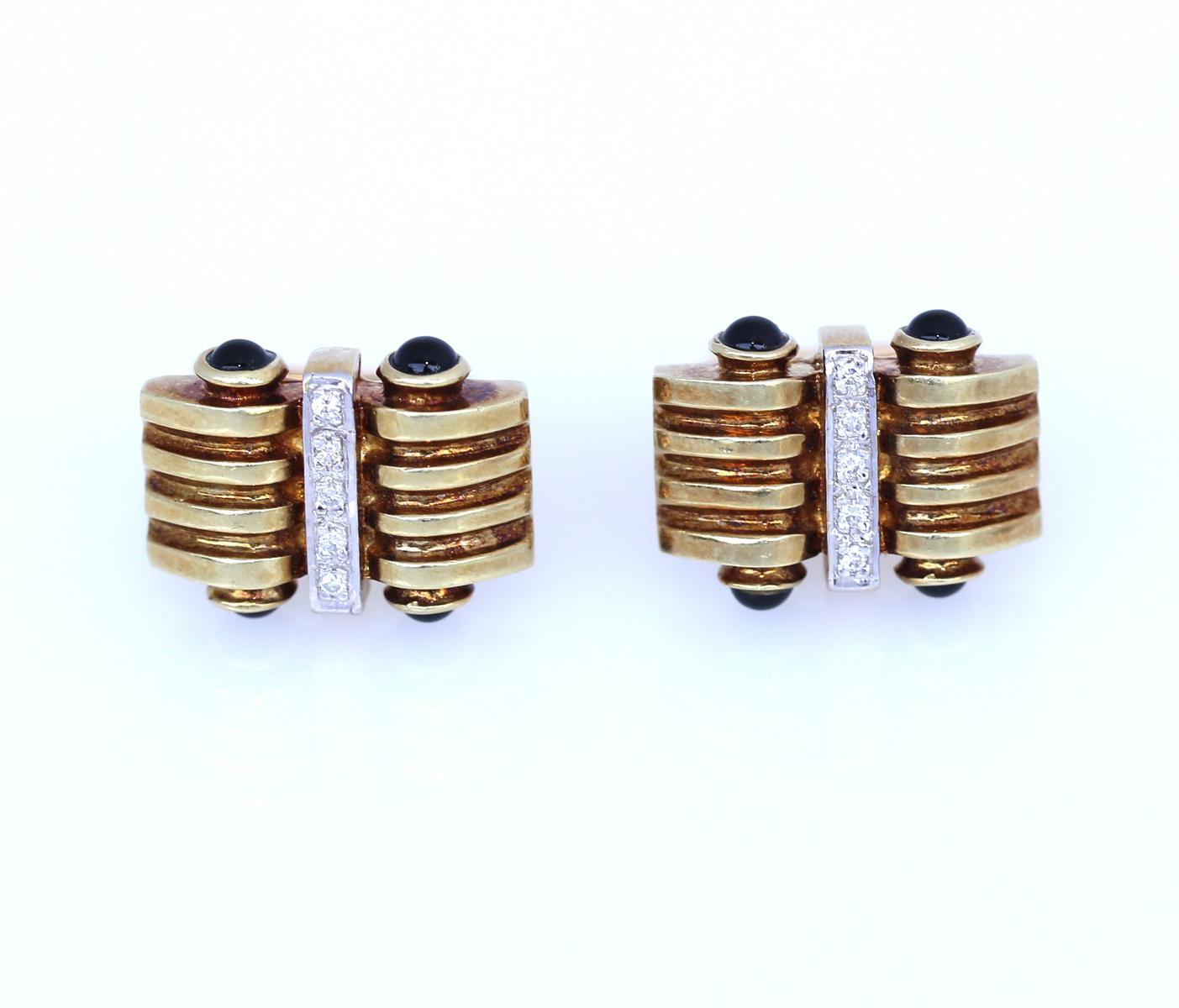 Late Art Deco style Gold Cufflinks with four Cabochon Sapphires in each. 
Back in the day, only a really wealthy gentleman could afford such a precious item.
Today it has lost none of its glamour. It is an amazing addition to any jewelry collection,