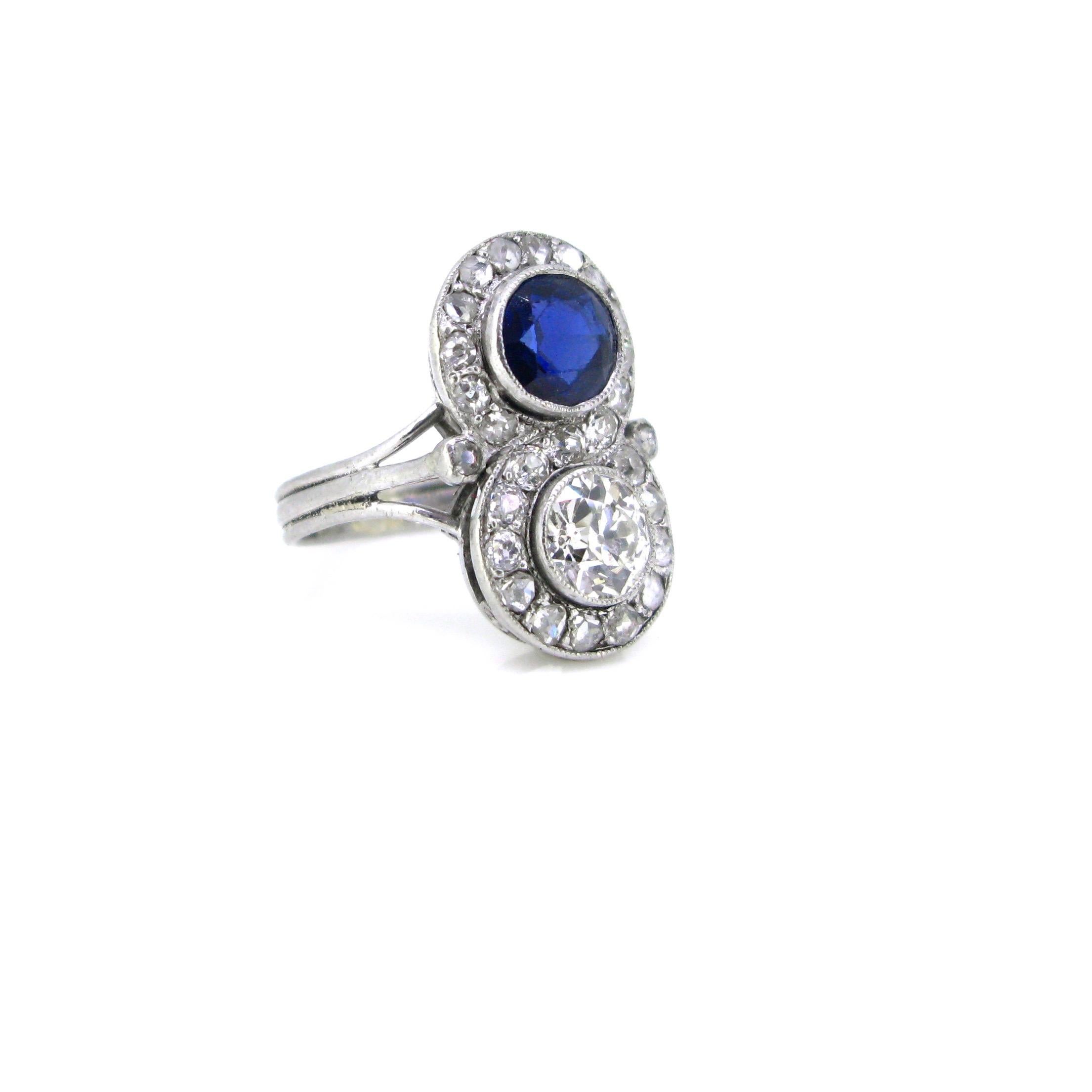 Art Deco Diamonds Sapphire Toi et Moi Crossover Platinum Ring In New Condition In London, GB